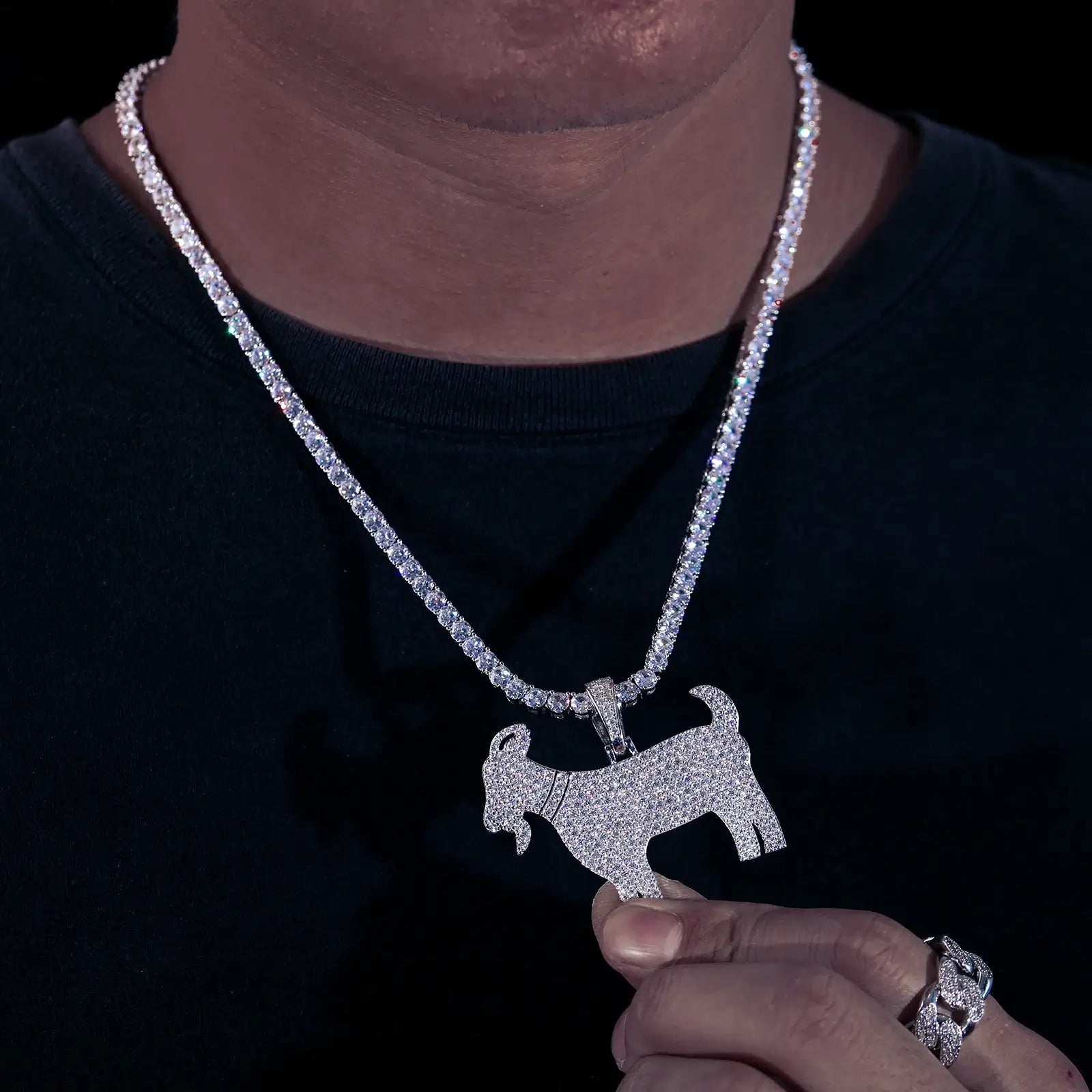 Man modeling goat pendant with tennis chain - S925 silver moissanite horns and celestial eyes | GRA-certified men's jewelry