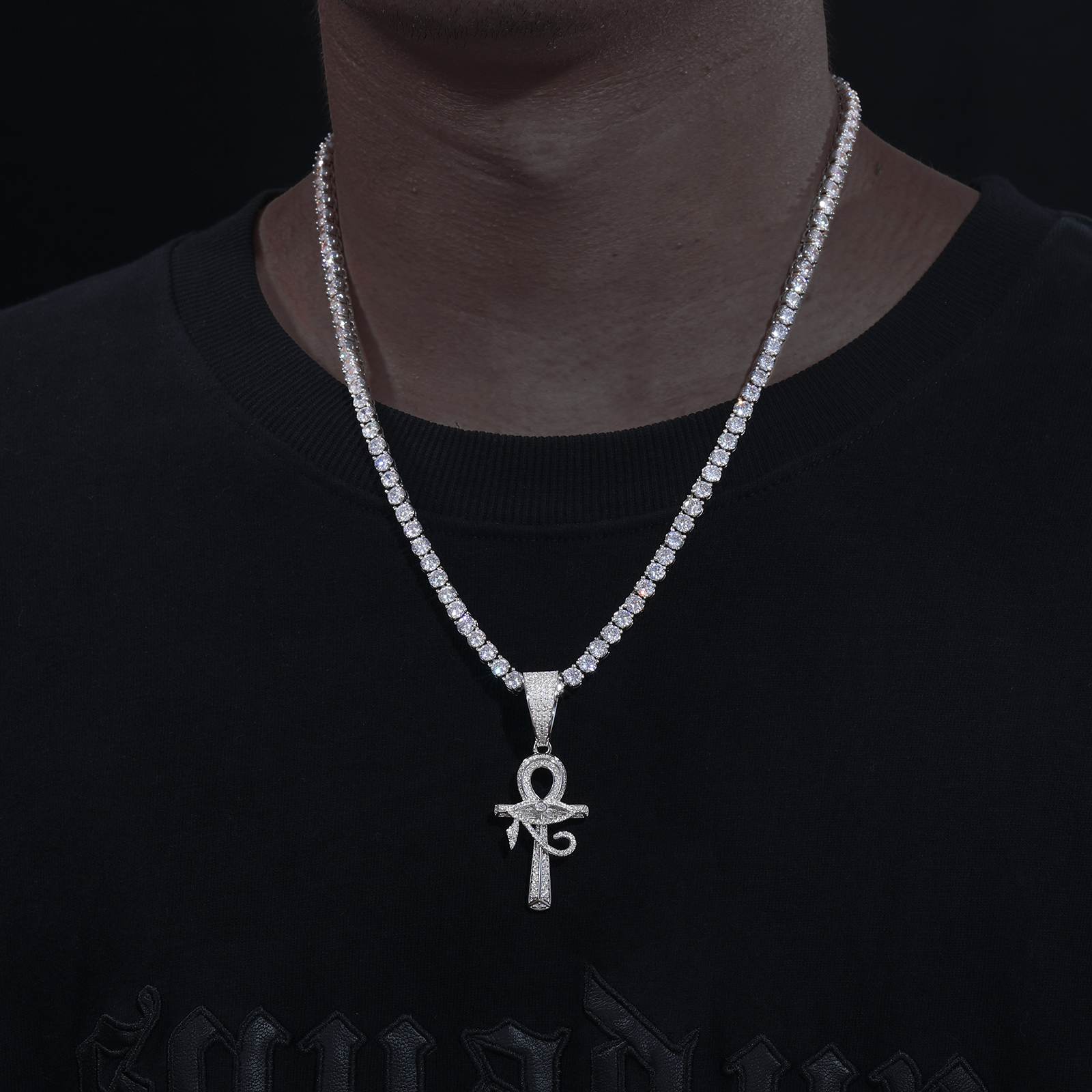 African American man styling white gold pendant on diamond tennis chain - S925 hypoallergenic armor contrasting melanin skin | Boardroom-to-street sacred armor