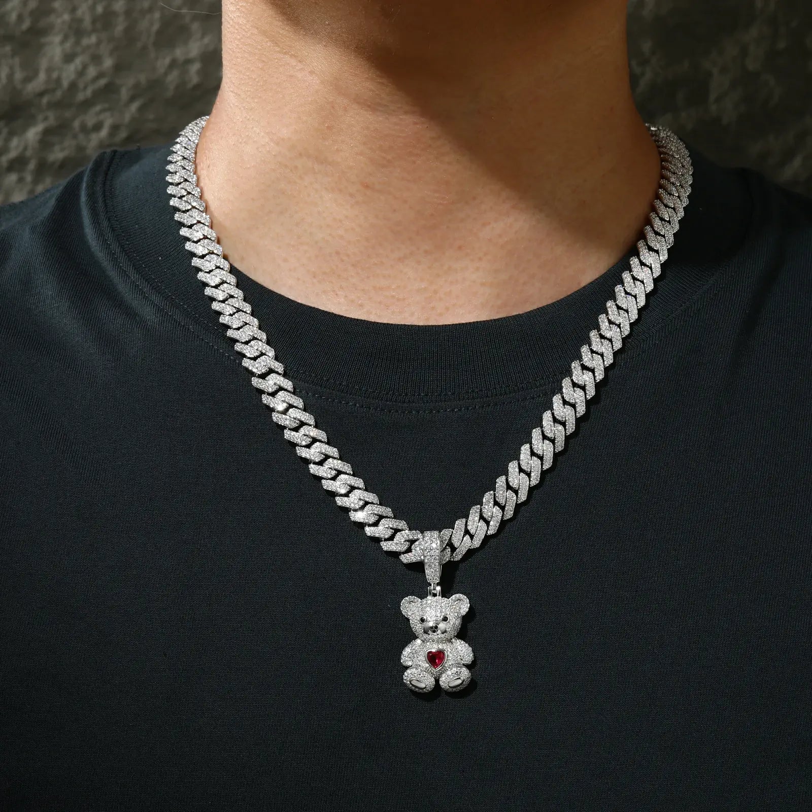 Male model wearing white gold sweetheart bear pendant on Cuban chain - 925 sterling silver moissanite jewelry for men