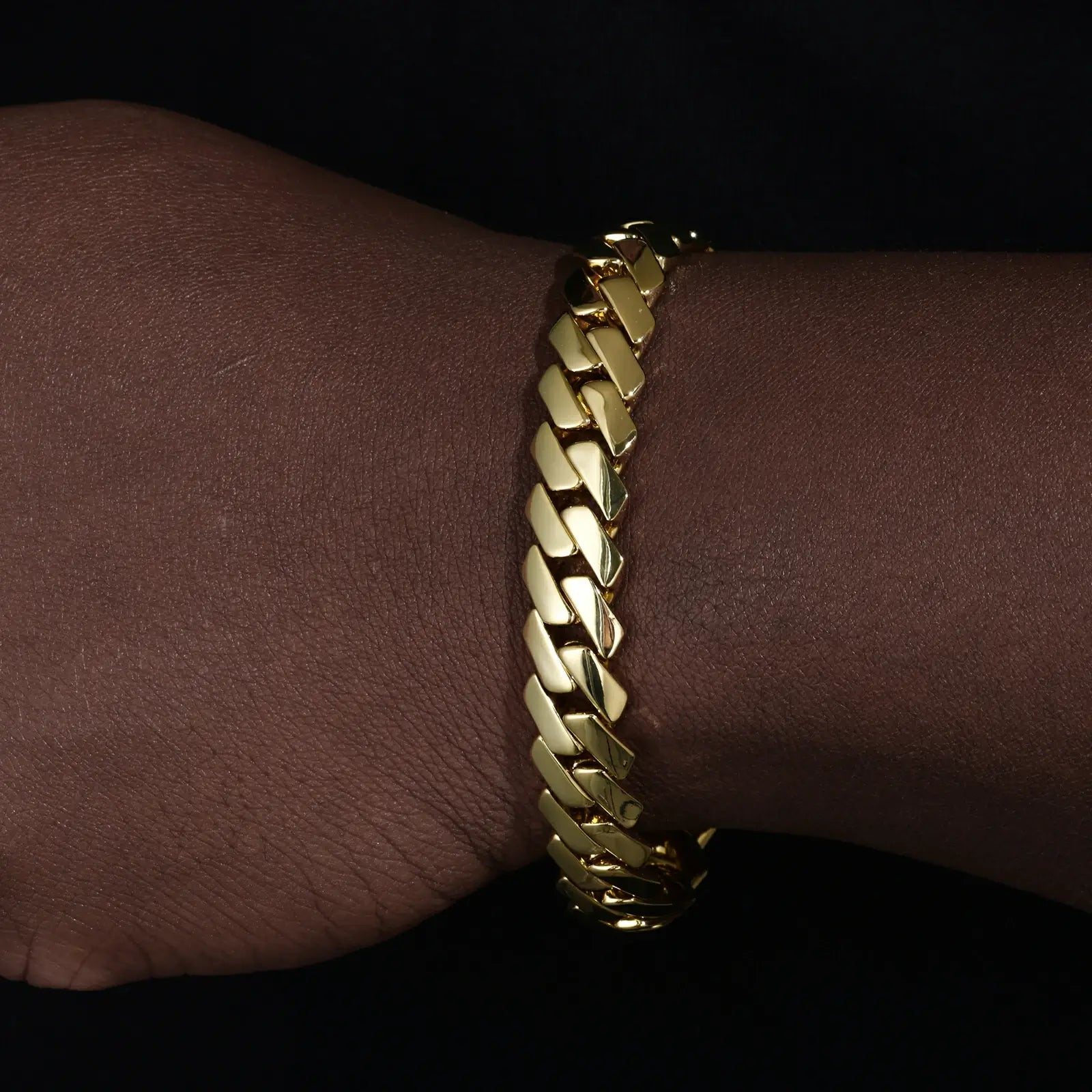African American man wearing 14K gold Cuban bracelet - Monaco pattern with secure EDGE clasp | Luxury streetwear accessory