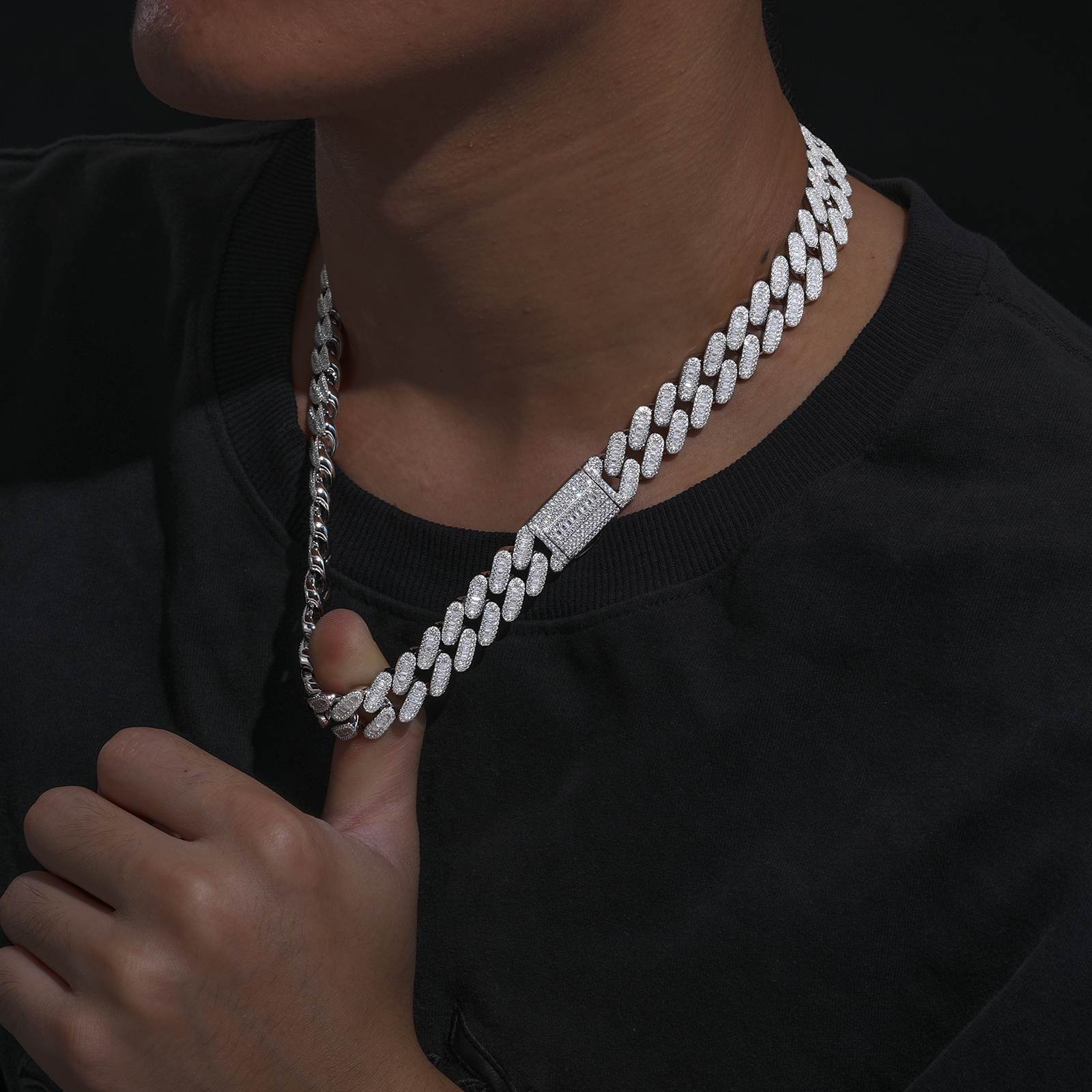 White gold Cuban chain layered with oxidized silver pendant, styled for modular streetwear aesthetics in graffiti alley settings.