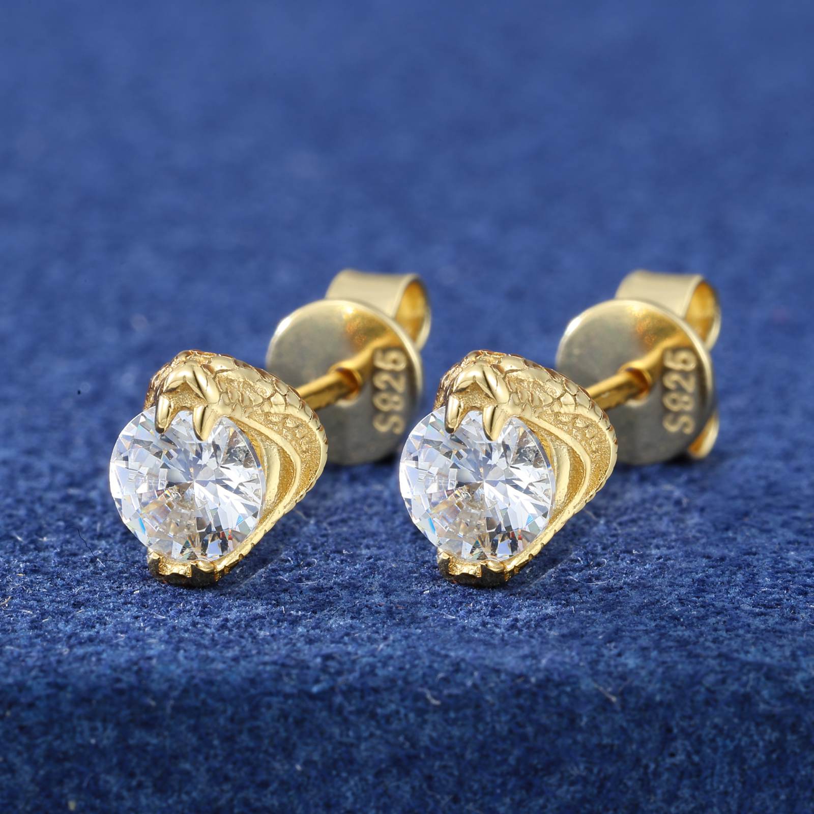 S925 cobra stud earrings glowing under UV light against a neon graffiti wall, showcasing military-grade 24K gold plating and DEF VVS moissanite’s diamond-tier sparkle for streetwear enthusiasts