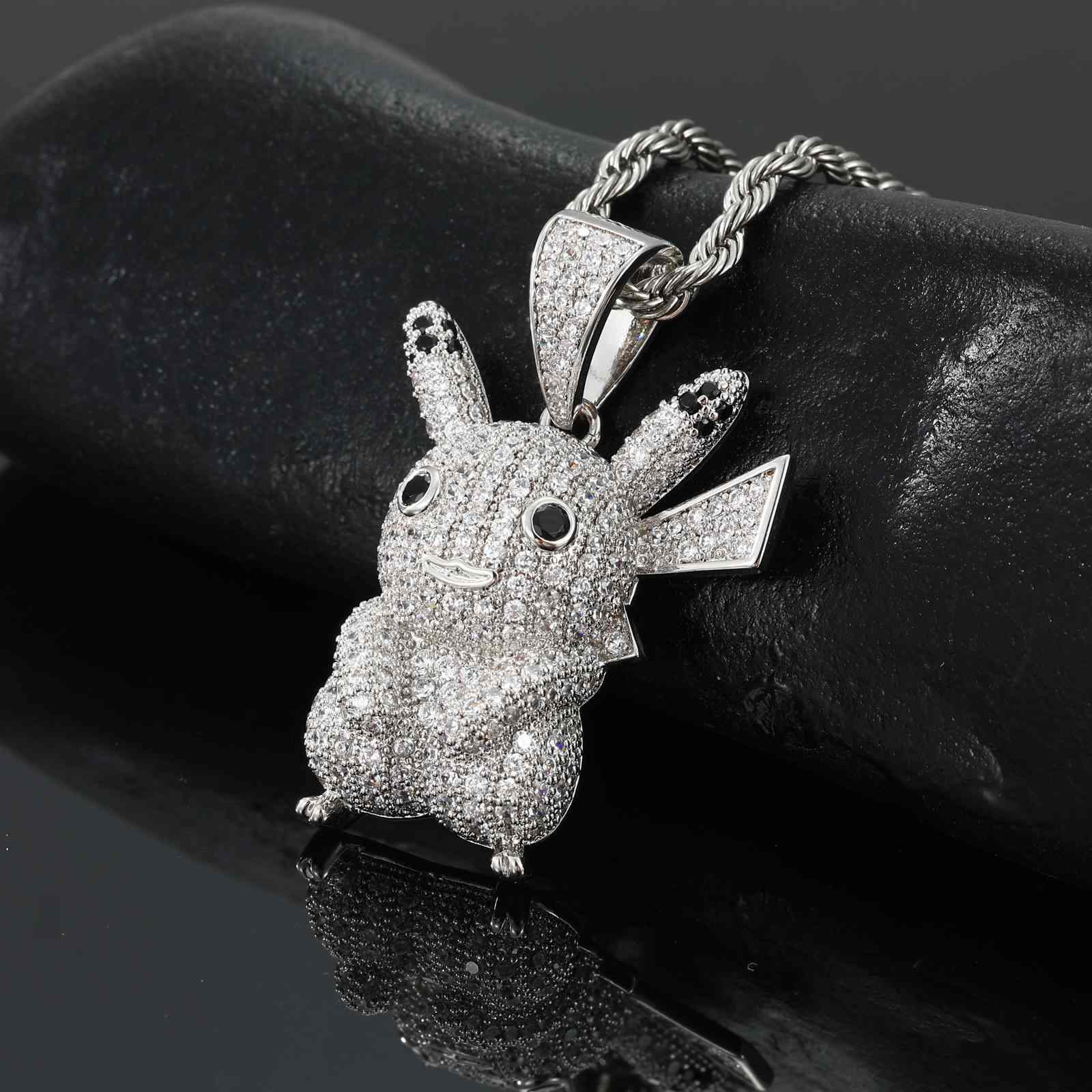 Side angle of Pikachu pendant, highlighting 3D sculpted tail, secure bail loop, and hypoallergenic 925 silver craftsmanship.