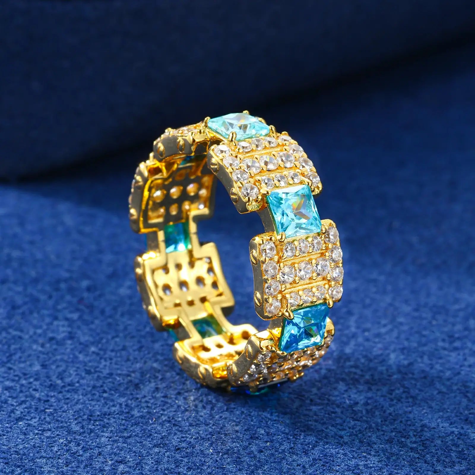 Profile view: Gold ocean ring on blue table - 2.5mm band thickness with seamless gradient stones | Salt-resistant construction