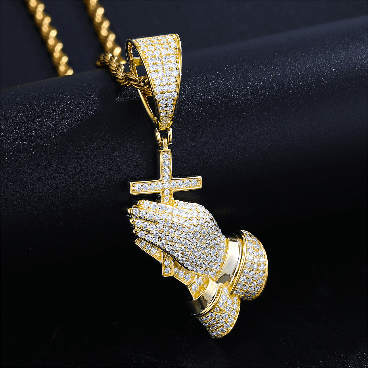 18K gold pray hand cross pendant on black velvet - VVS moissanite knuckles radiating sacred light | Hypoallergenic spiritual armor