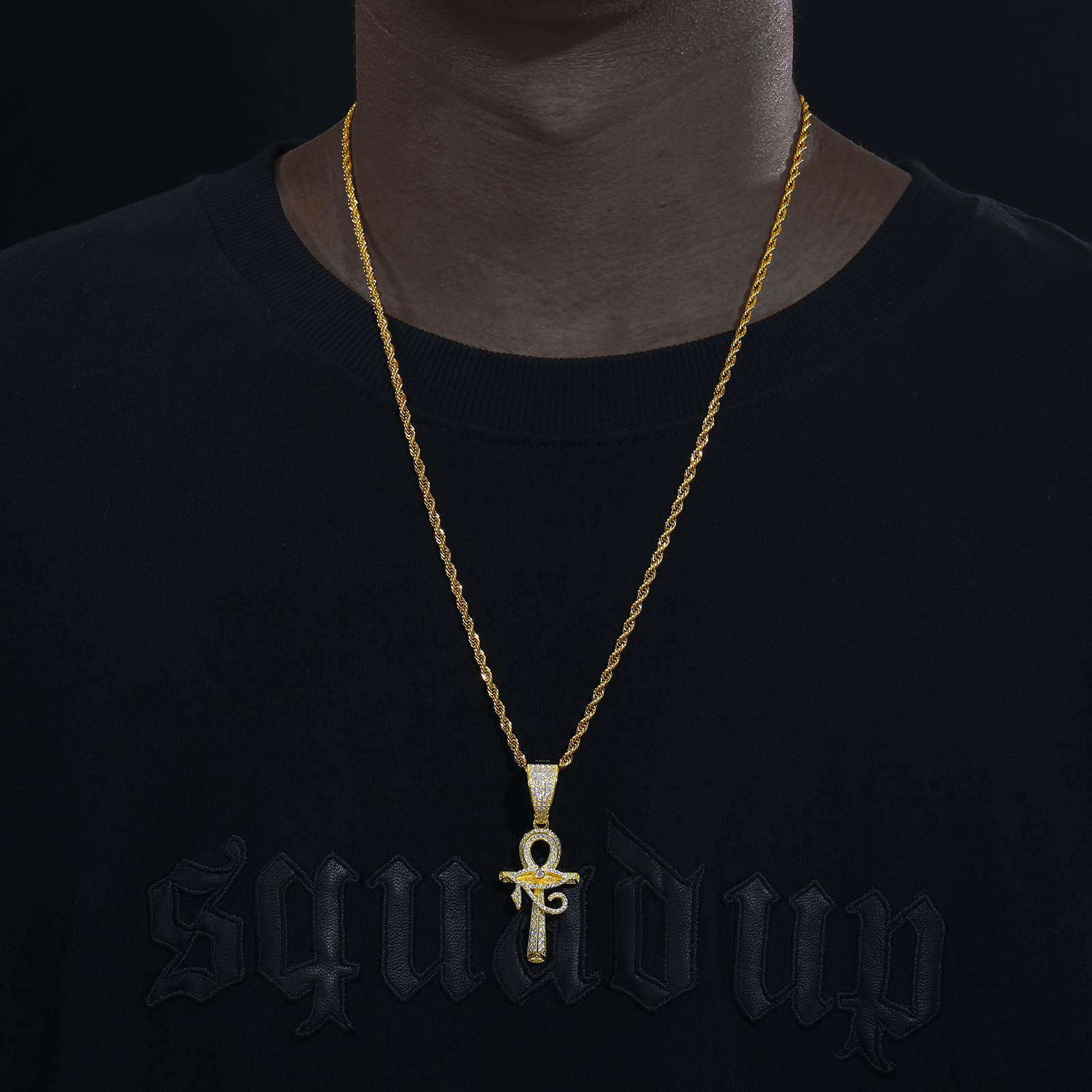 Street influencer wearing gold evil eye ankh on twisted chain - lab-grown moissanite outshining diamonds | Salt-spray tested waterproof core