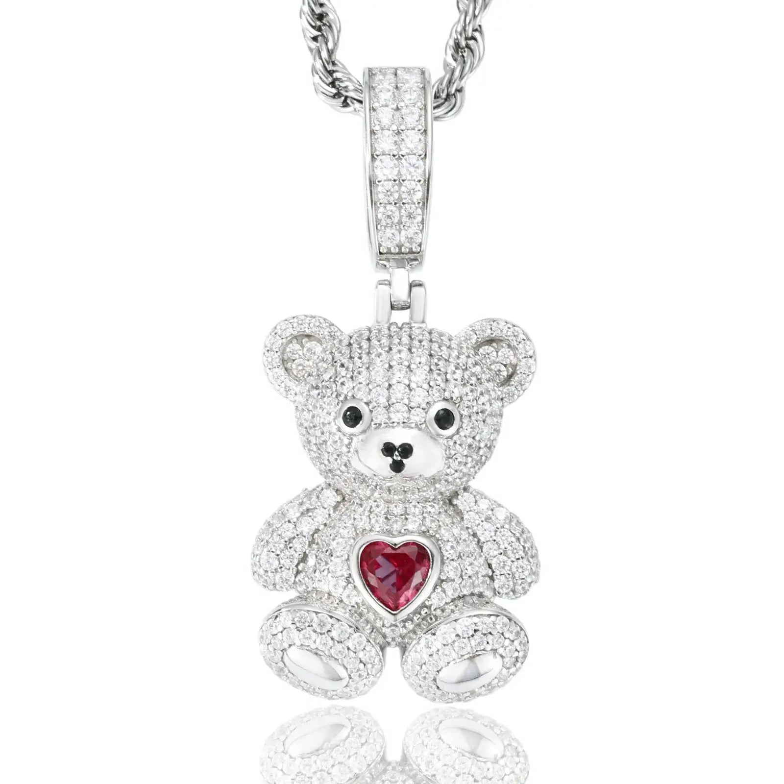 White gold sweetheart bear pendant isolated on white background - moissanite stones and red zircon heart sparkling clearly