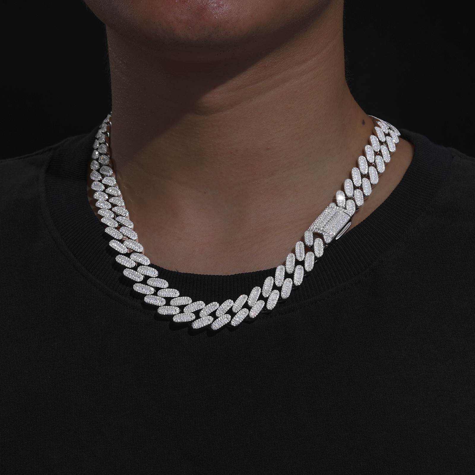 Male model styling the white gold-plated Cuban chain with distressed leather jacket, embodying anti-logo luxury for underground scenes