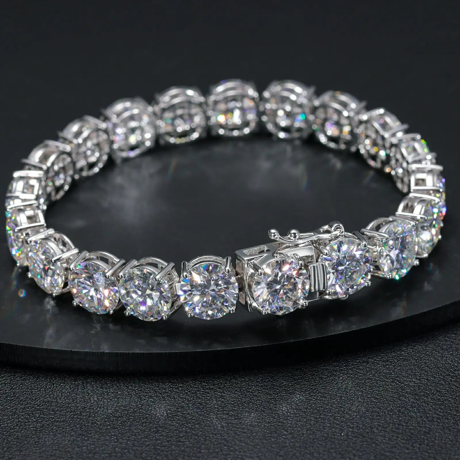 Complete 10mm white gold moissanite tennis bracelet displayed on black desktop, showing 11-stone luxury design and elegant packaging.