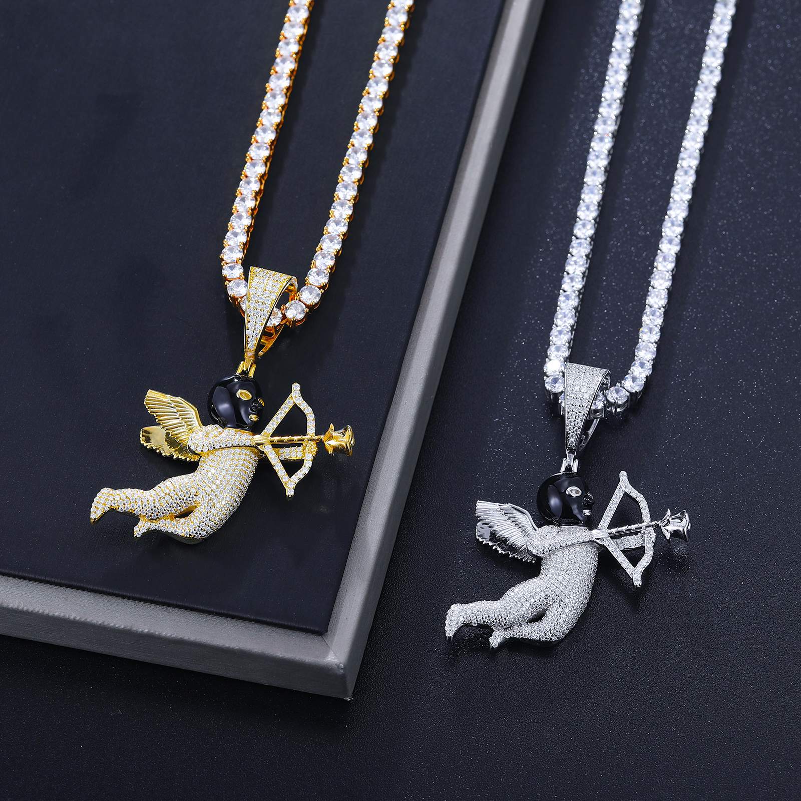 Side-by-side Cupid pendants with black masked arrows - 42 VVS moissanites per piece | ISO 9227 tarnish-proof certification