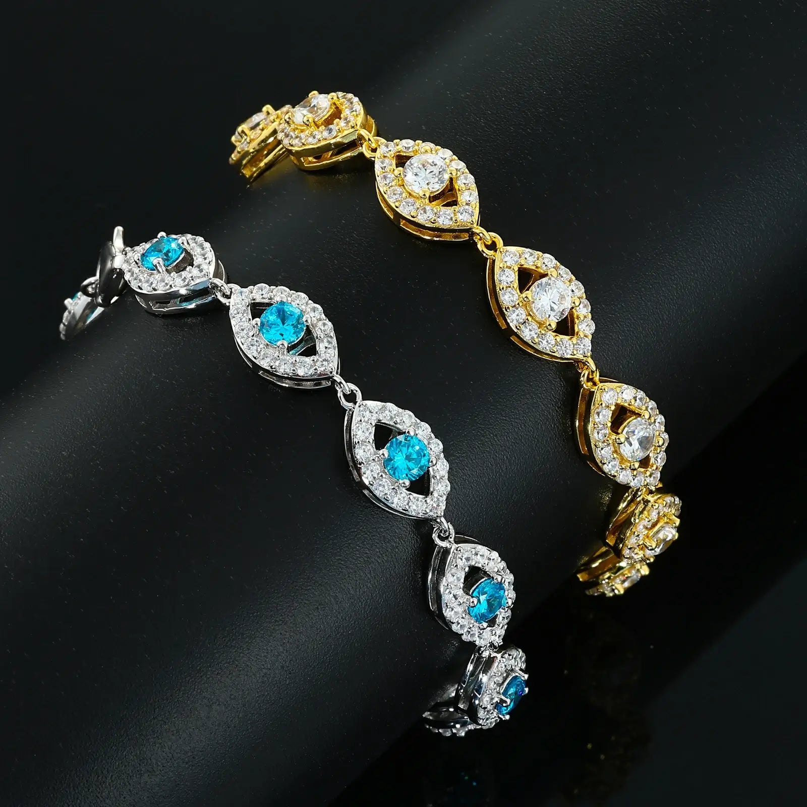 White gold-tone vs yellow gold evil eye bracelets side-by-side - identical 14mm links with 38 VVS moissanites each | Tarnish-proof engineering