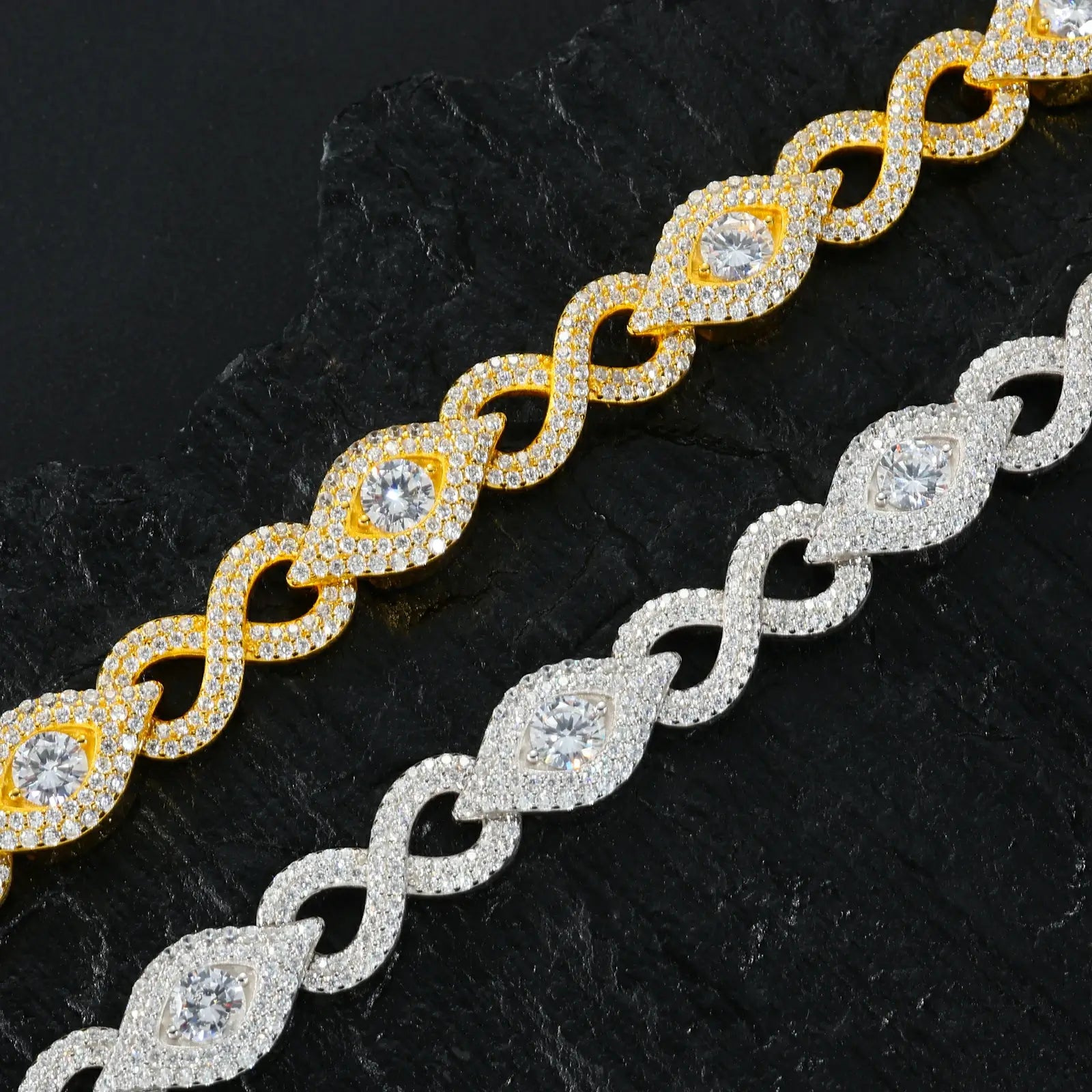 Engineering comparison: white gold & yellow gold plated Evil Eye links - microscopic view of prong-set moissanites and hinge durability