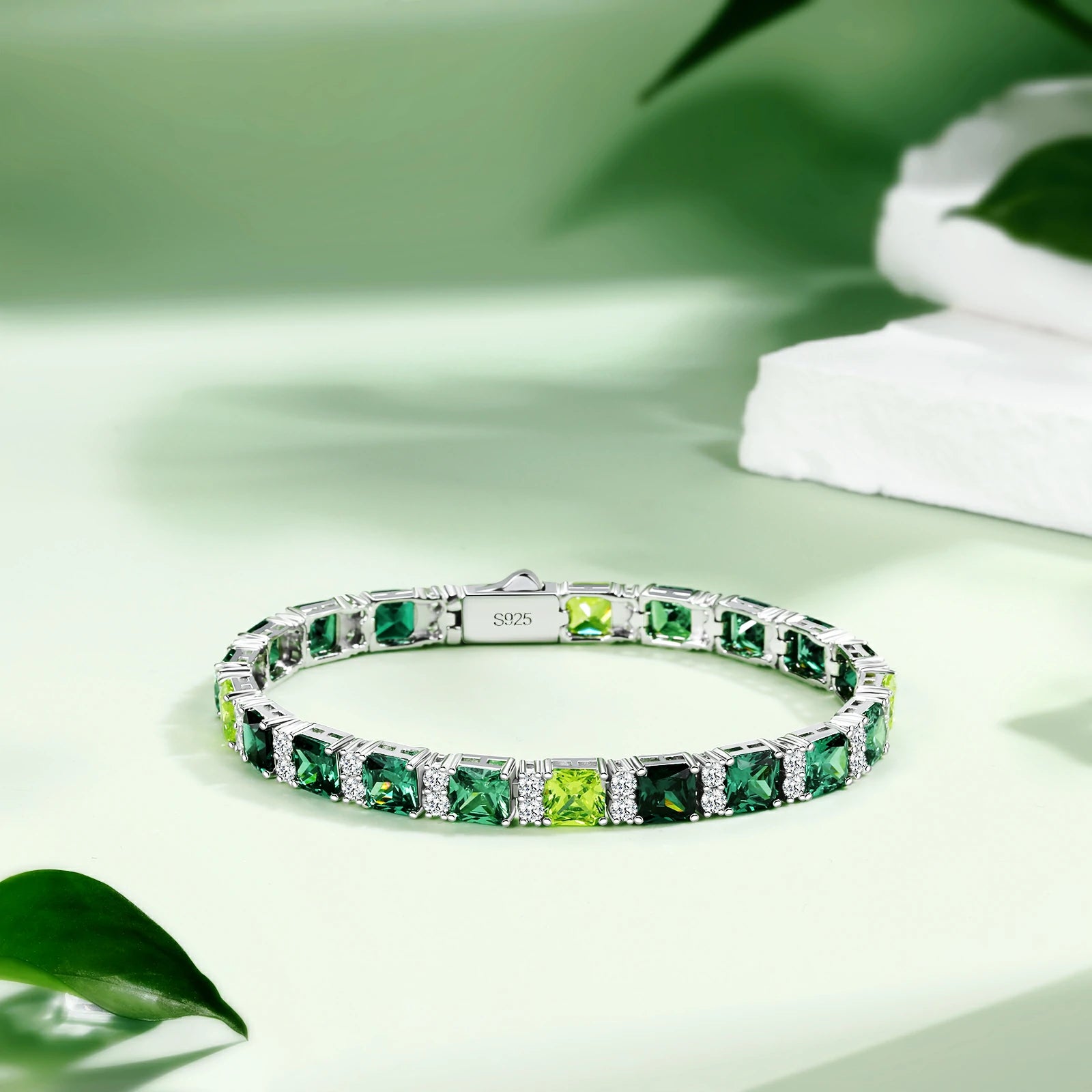 White gold bracelet on sage backdrop - Emerald City color-gradient Asscher stones transition | EN1811 nickel-free jewelry
