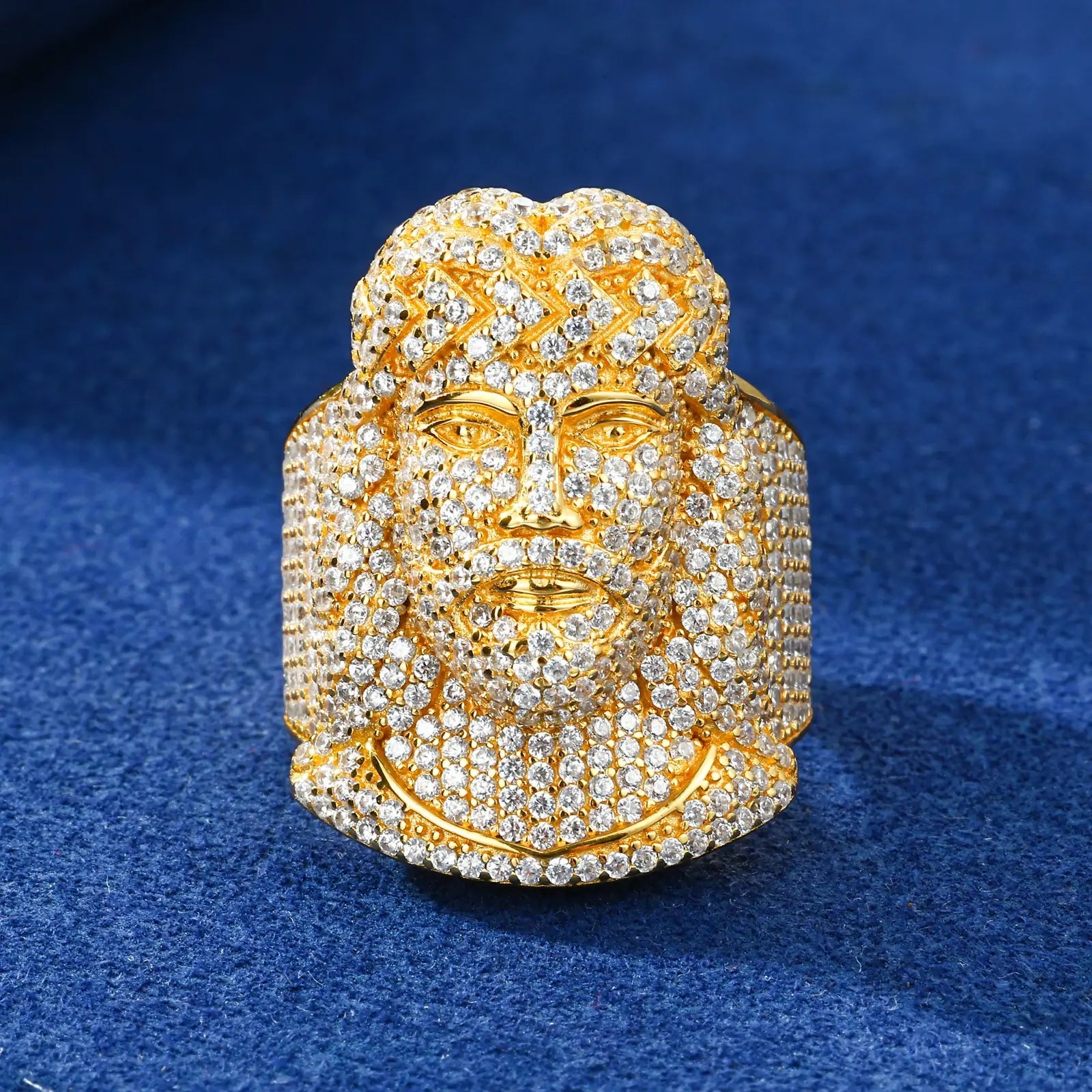 Gold Jesus ring on blue surface - micro-pavé halo crown detail | Waterproof S925 silver core with 24K plating
