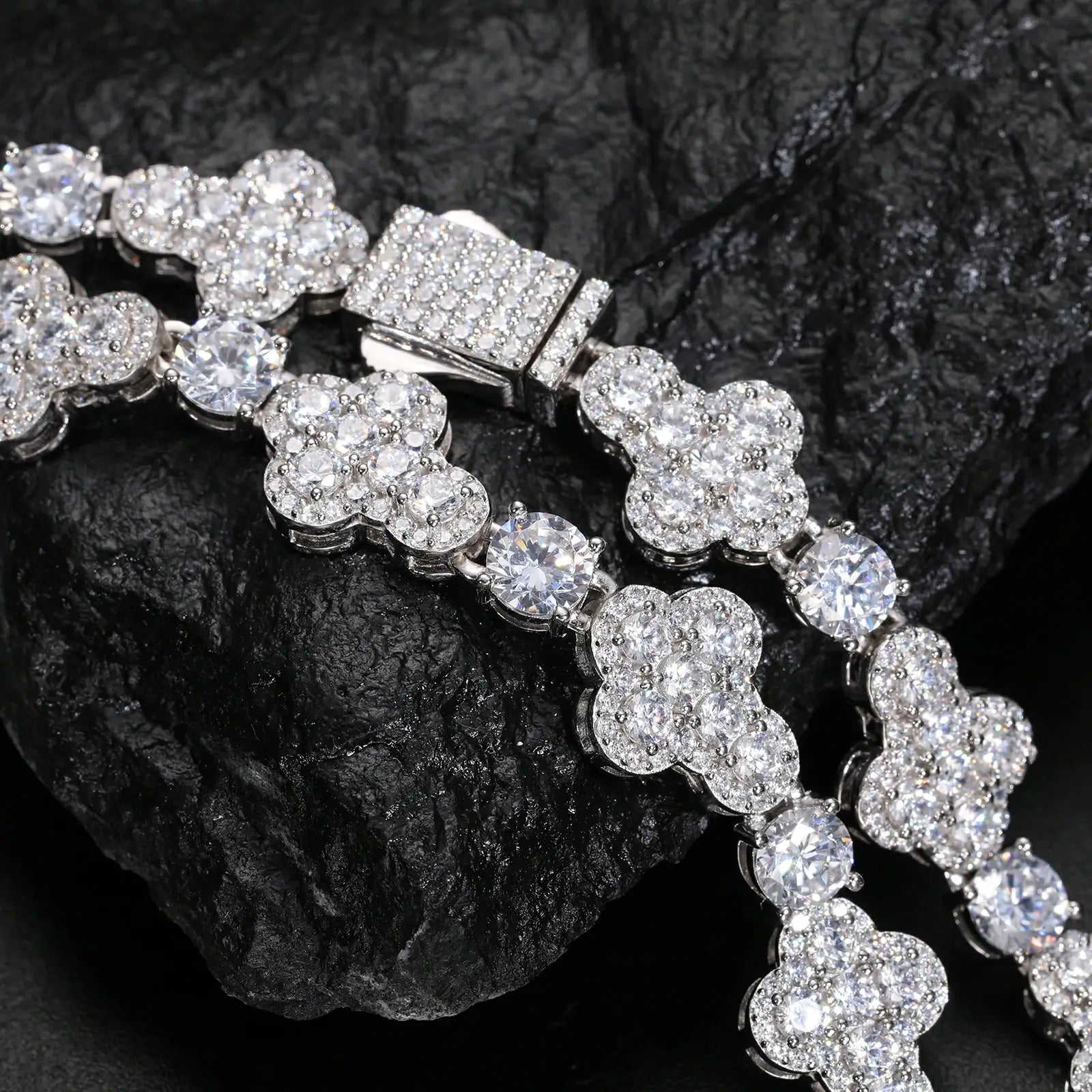 Extreme close-up of 10mm white gold moissanite cross tennis chain - detailed cross pendants and secure chain links in 925 sterling silver