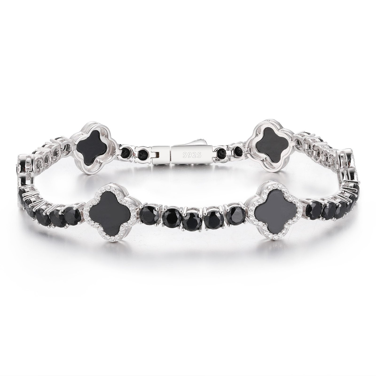 Black enamel moissanite four-leaf clover bracelet on white background, showcasing bold contrast and ethical luxury.