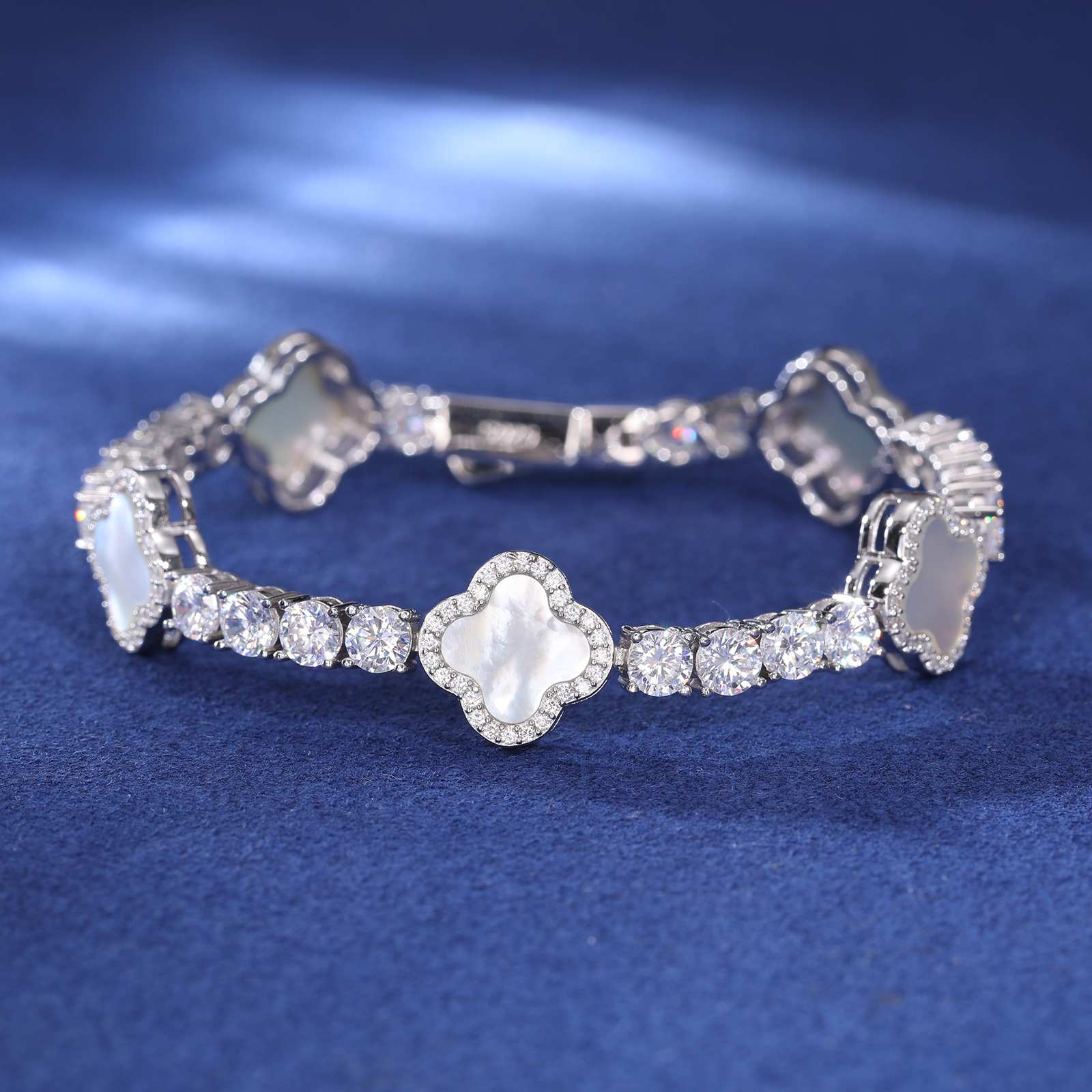 Full view of white enamel four-leaf clover bracelet with 4mm moissanite stones, set in polished S925 silver for luxury everyday wear.