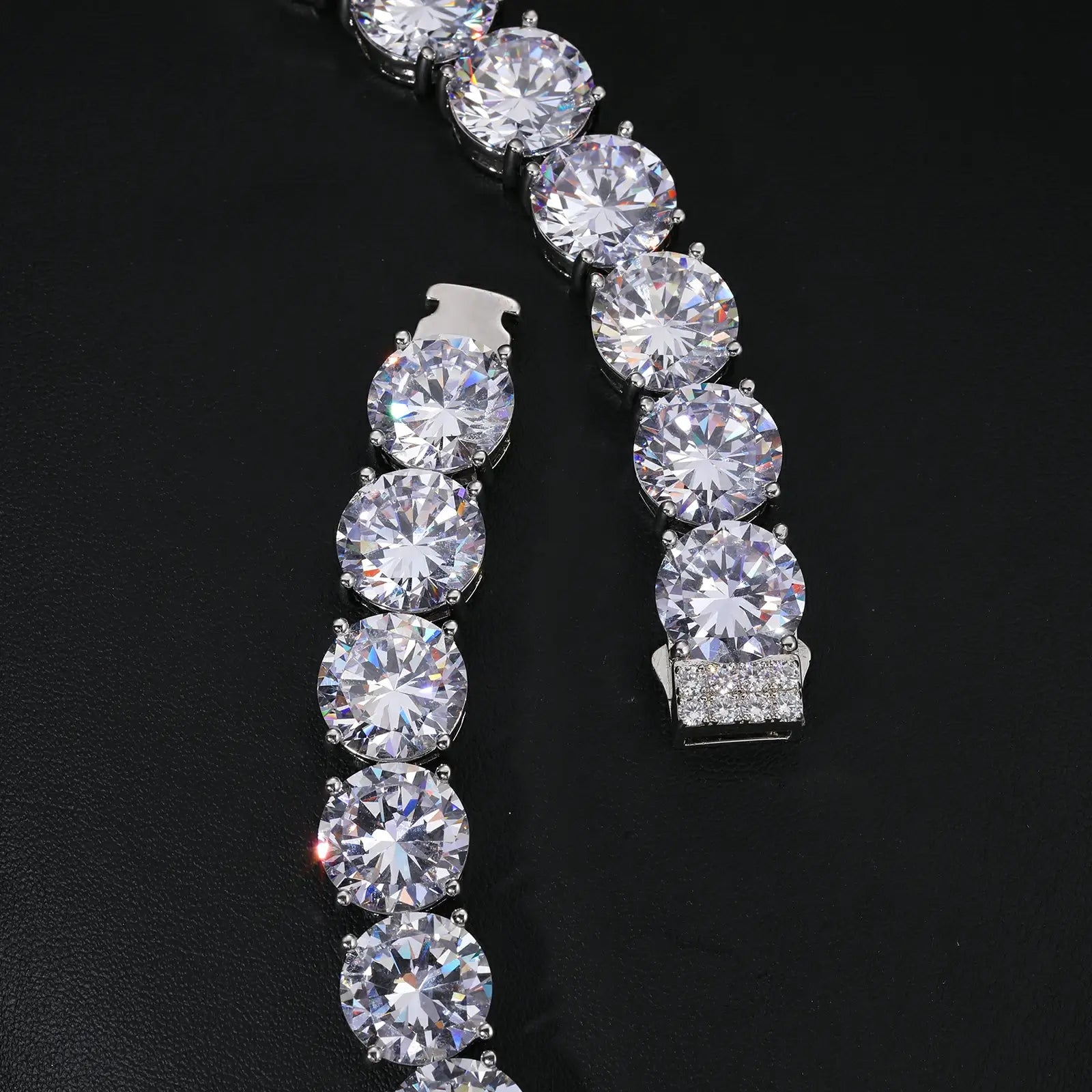 Close-up of 15mm white gold moissanite tennis bracelet clasp - secure locking mechanism on 925 sterling silver luxury jewelry