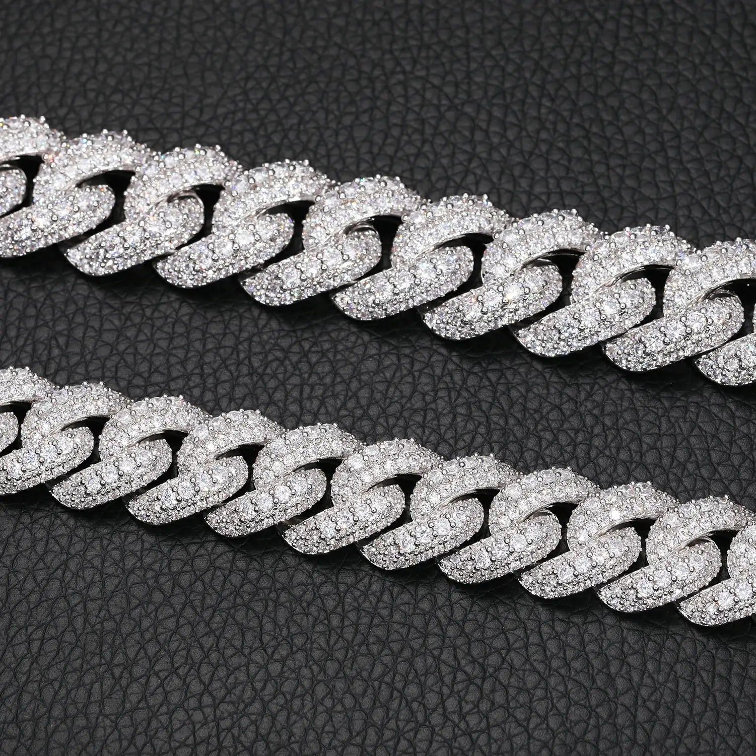 Close-up of 15mm white gold Cuban chain’s bubble links, featuring precision-set moissanite stones with diamond-like brilliance and durability.