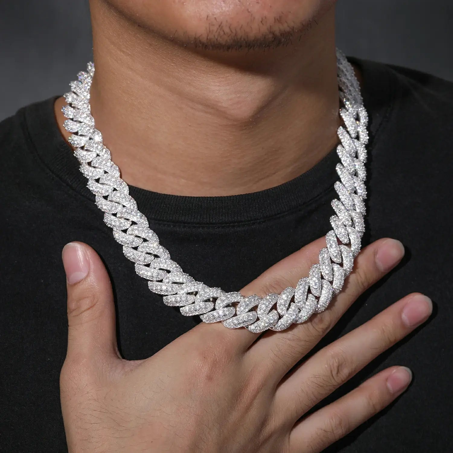 Close-up of model wearing 18mm white gold Cuban chain with moissanite stones, highlighting intricate bubble design and premium S925 sterling silver craftsmanship.