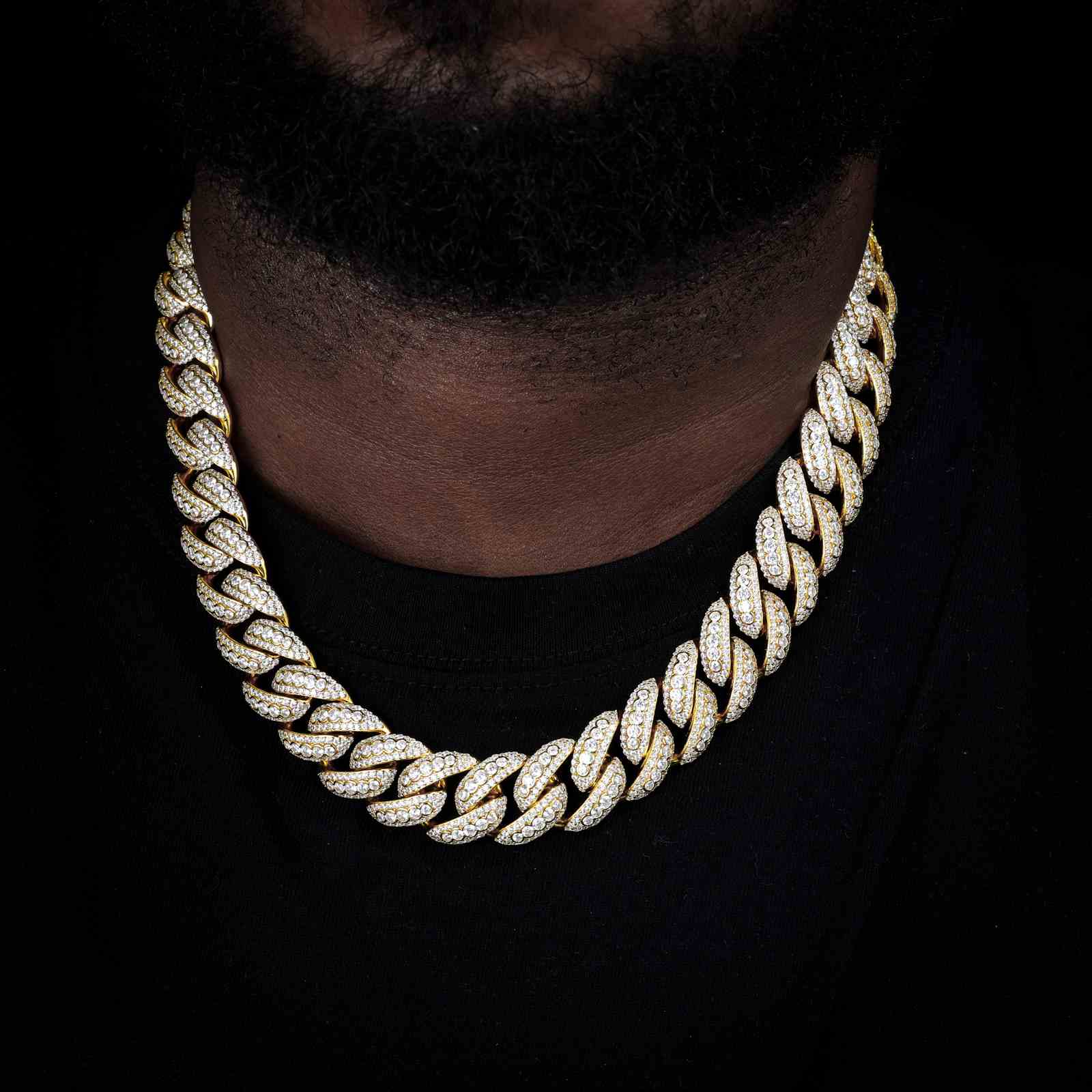 Black male model showcasing the 24K gold-plated Star Trails Cuban chain. Lab-created zirconia stones, secure box clasp, and chunky bubble links designed for street culture dominance