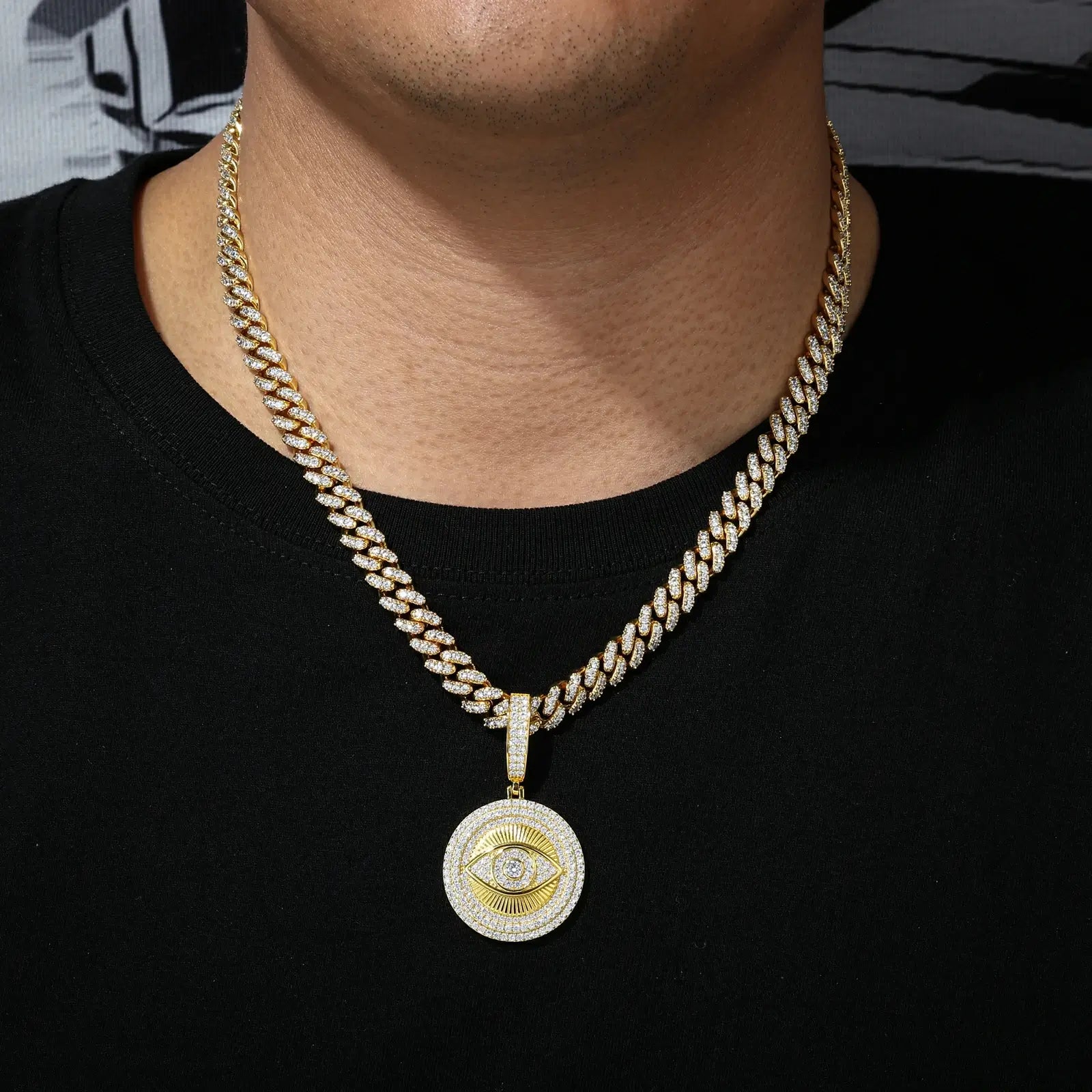 Male model wearing 925 sterling silver moissanite evil eye sun dog tag pendant (yellow gold) with cuban chain, men’s waterproof bling jewelry