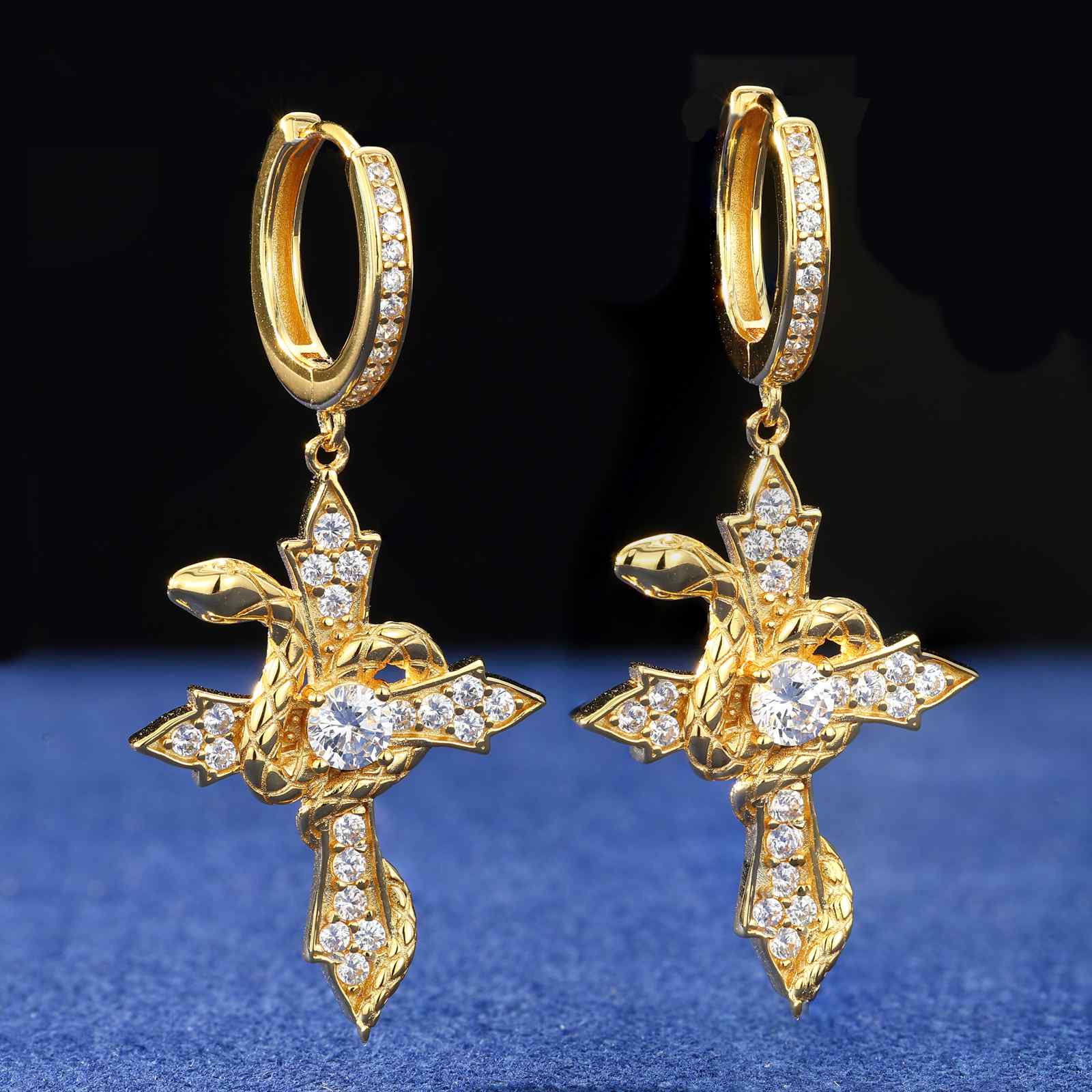 Gold 925 silver snake wrap cross drop earrings with moissanite stones, showcasing intricate coil design and diamond-like sparkle on white background.