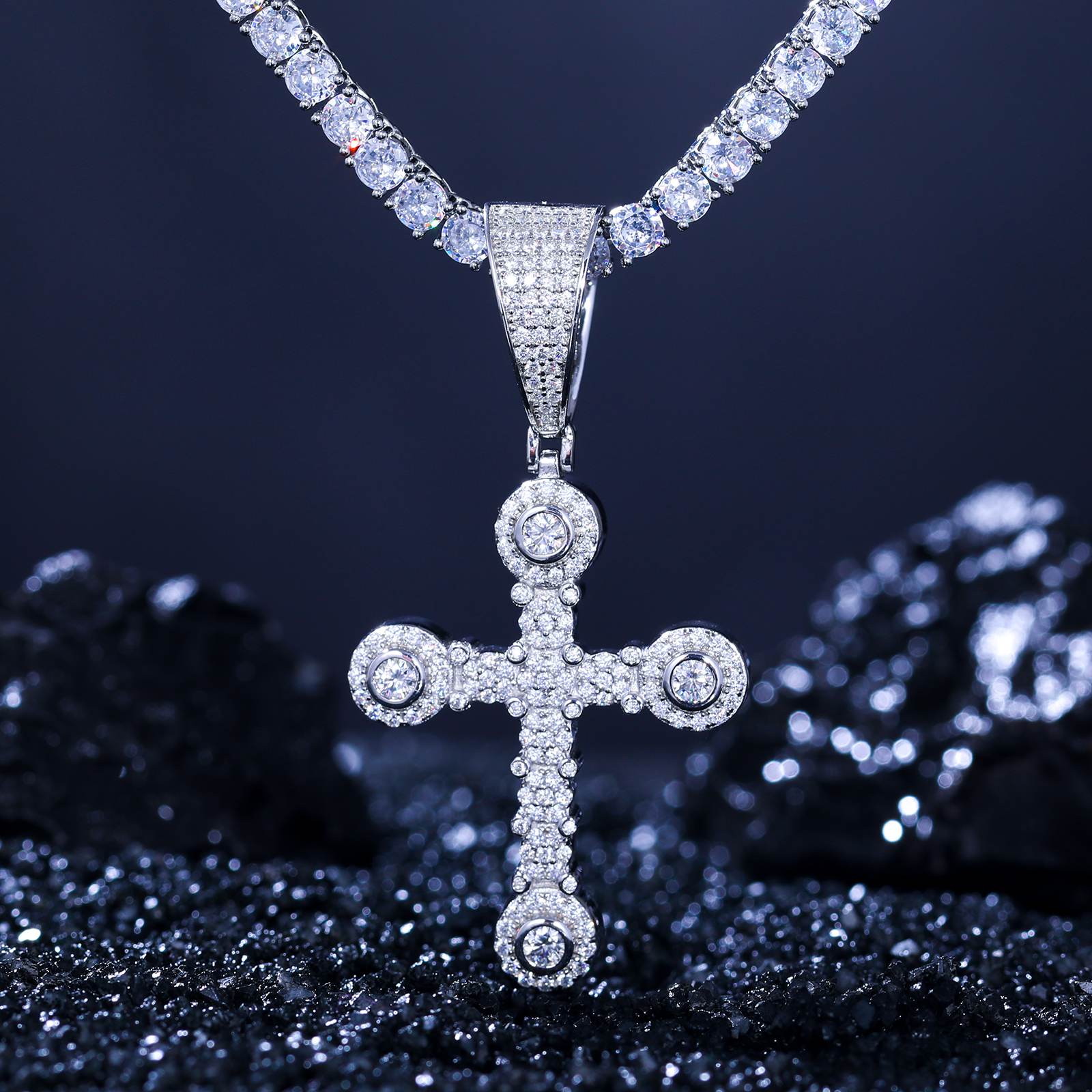 S925 white gold star-studded cross pendant with moissanite tennis chain on black velvet - VVS stones refracting 2.65 RI divine light | Christian luxury jewelry