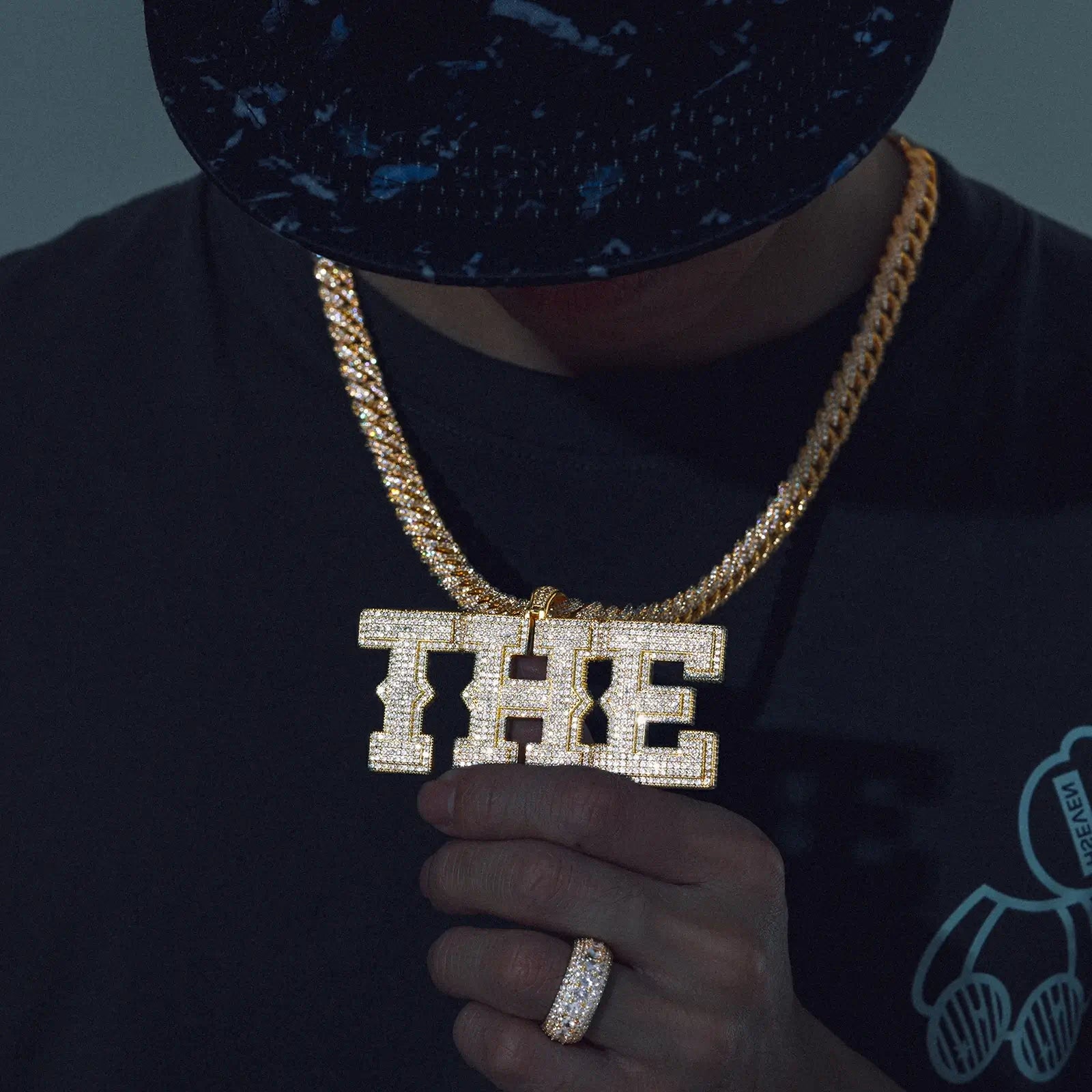 Gold 925 sterling silver moissanite custom spine letter name pendant wearing with iced-out ring — coordinated hip-hop look, moissanite brilliance, 925 silver durability, personalized name jewelry