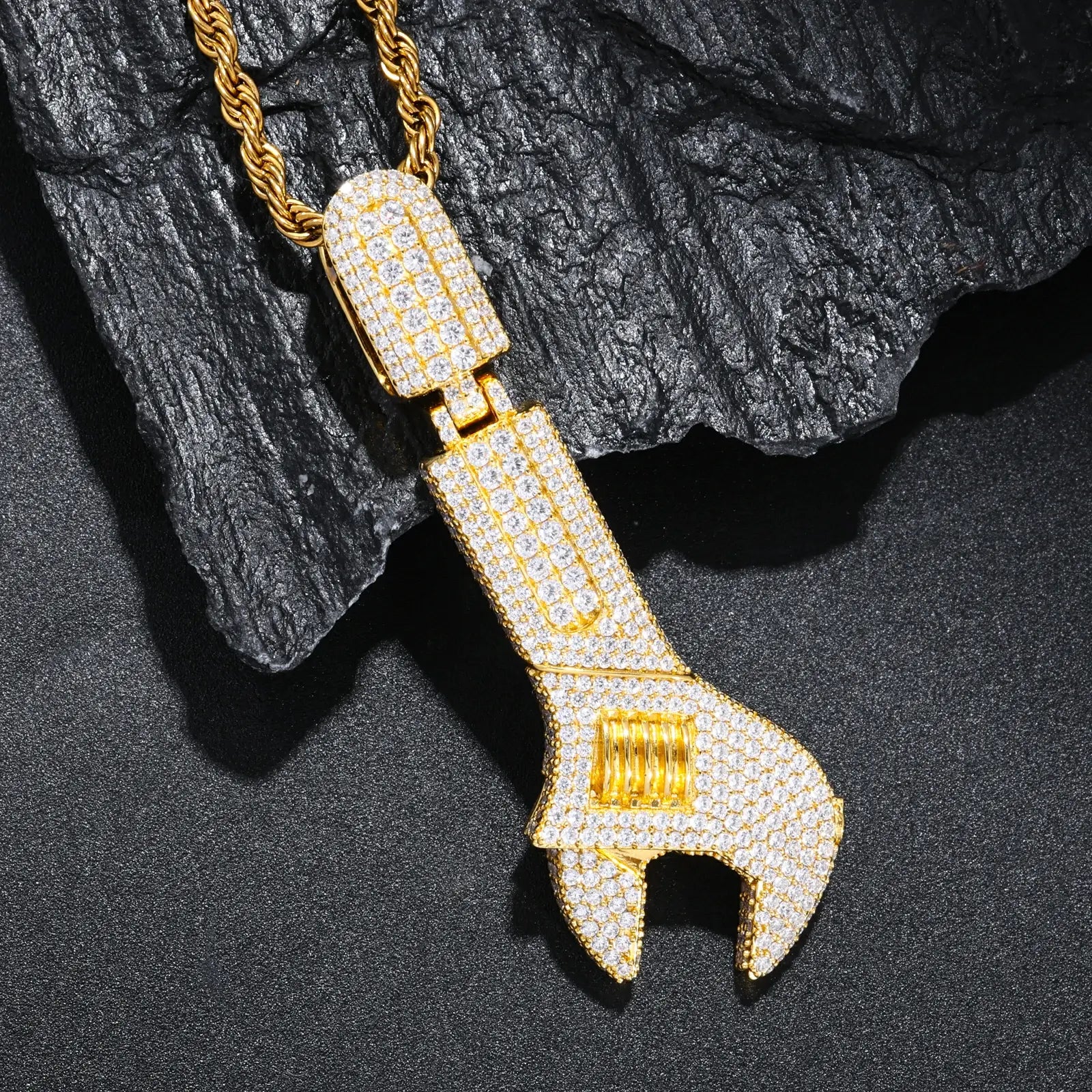 Gold 925 sterling silver moissanite wrench pendant on black background — detailed moissanite inlay, 925 silver base, bold wrench shape, street luxury trend