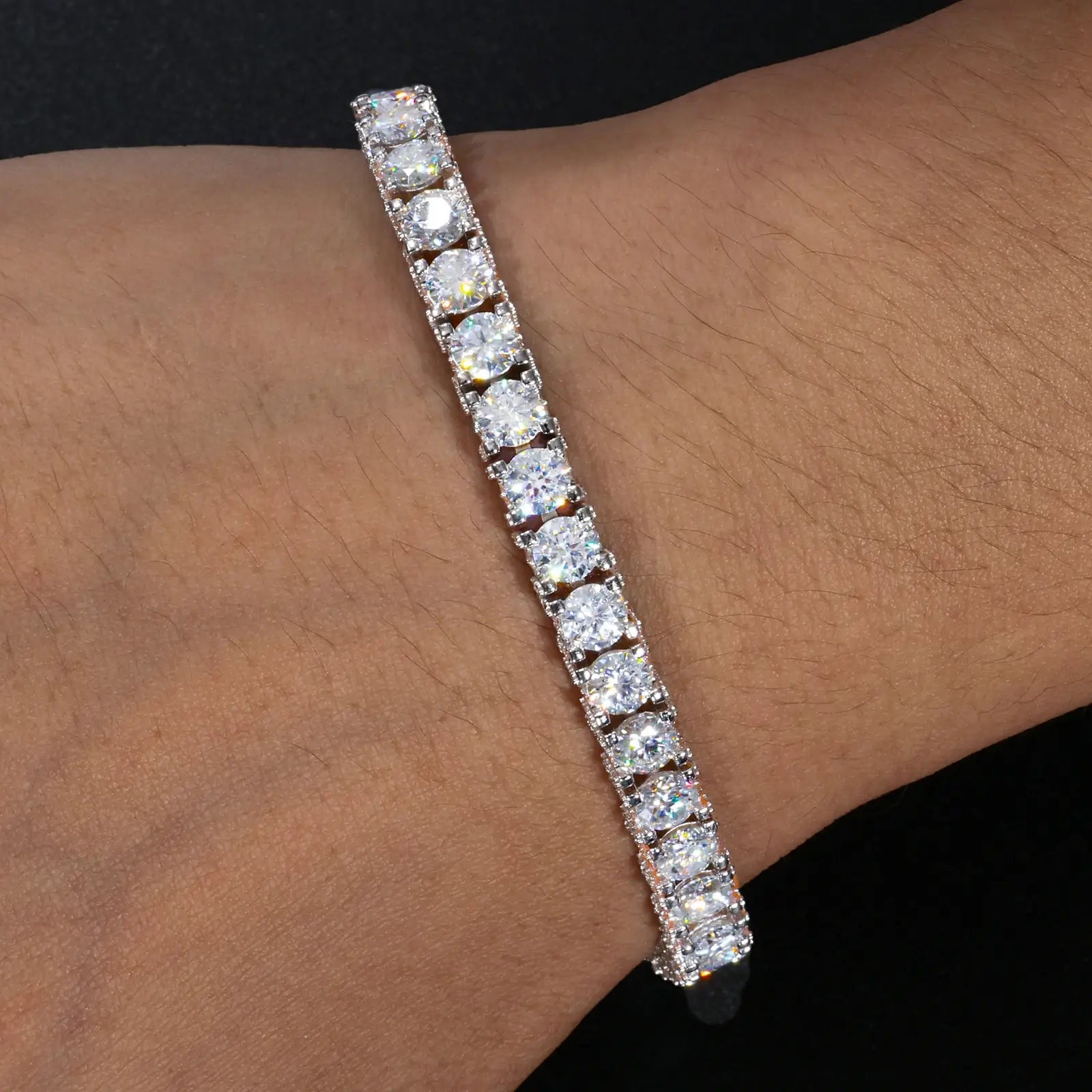 Male model wearing white gold 5mm 925 sterling silver moissanite full iced tennis bracelet in casual style — tarnish-resistant 925 silver, all-around moissanite shine, ideal for everyday luxury