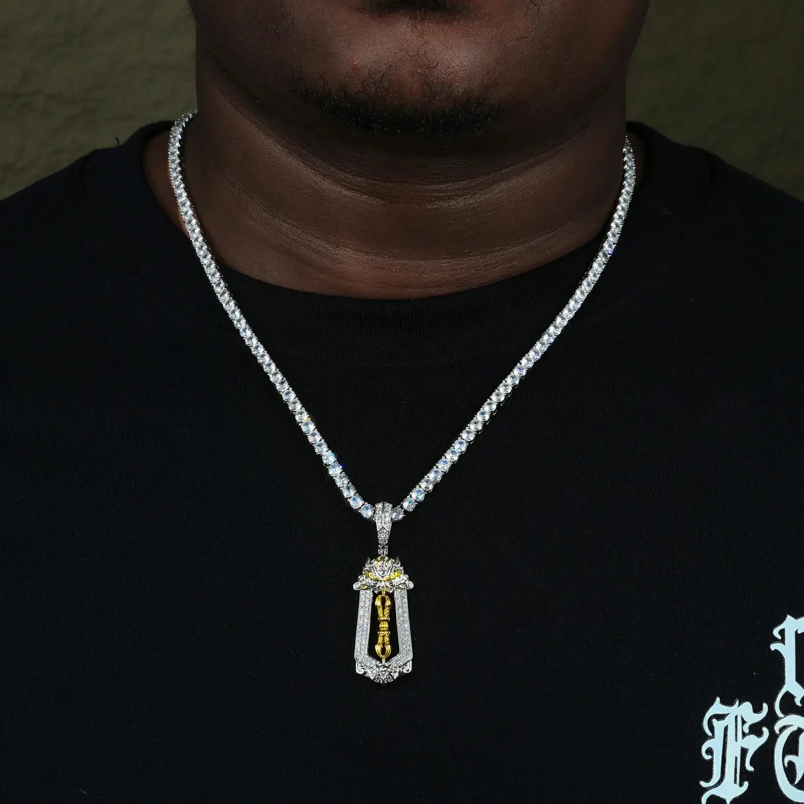 Male model wearing white gold 925 sterling silver moissanite brave troops vajra pendant with tennis chain — hypoallergenic 925 silver, diamond-like moissanite, bold vajra design