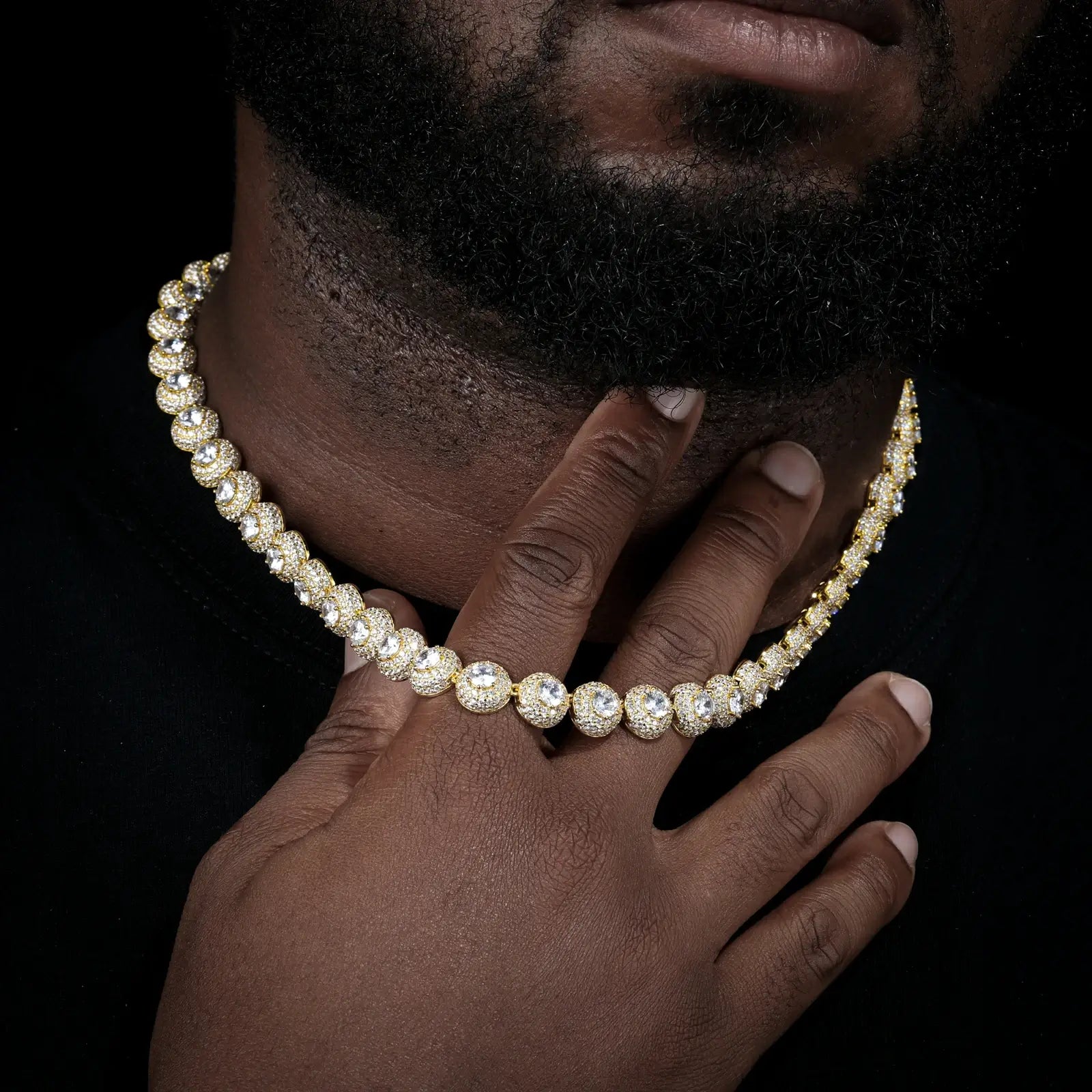 Male model wearing yellow gold 10mm 925 sterling silver moissanite round halo tennis chain in street style — showcases iced-out luxury, round halo design, hypoallergenic 925 silver