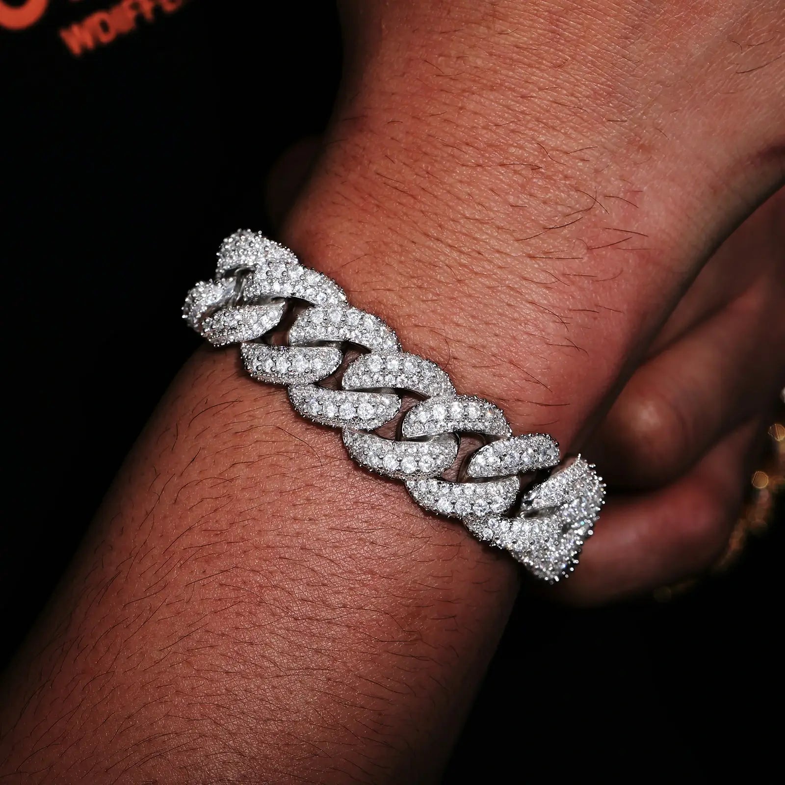 Model wearing silver 18mm 925 sterling silver 3 rows moissanite bubble Cuban link bracelet — highlights classic silver finish, diamond-like moissanite, 925 silver durability, Cuban link trend