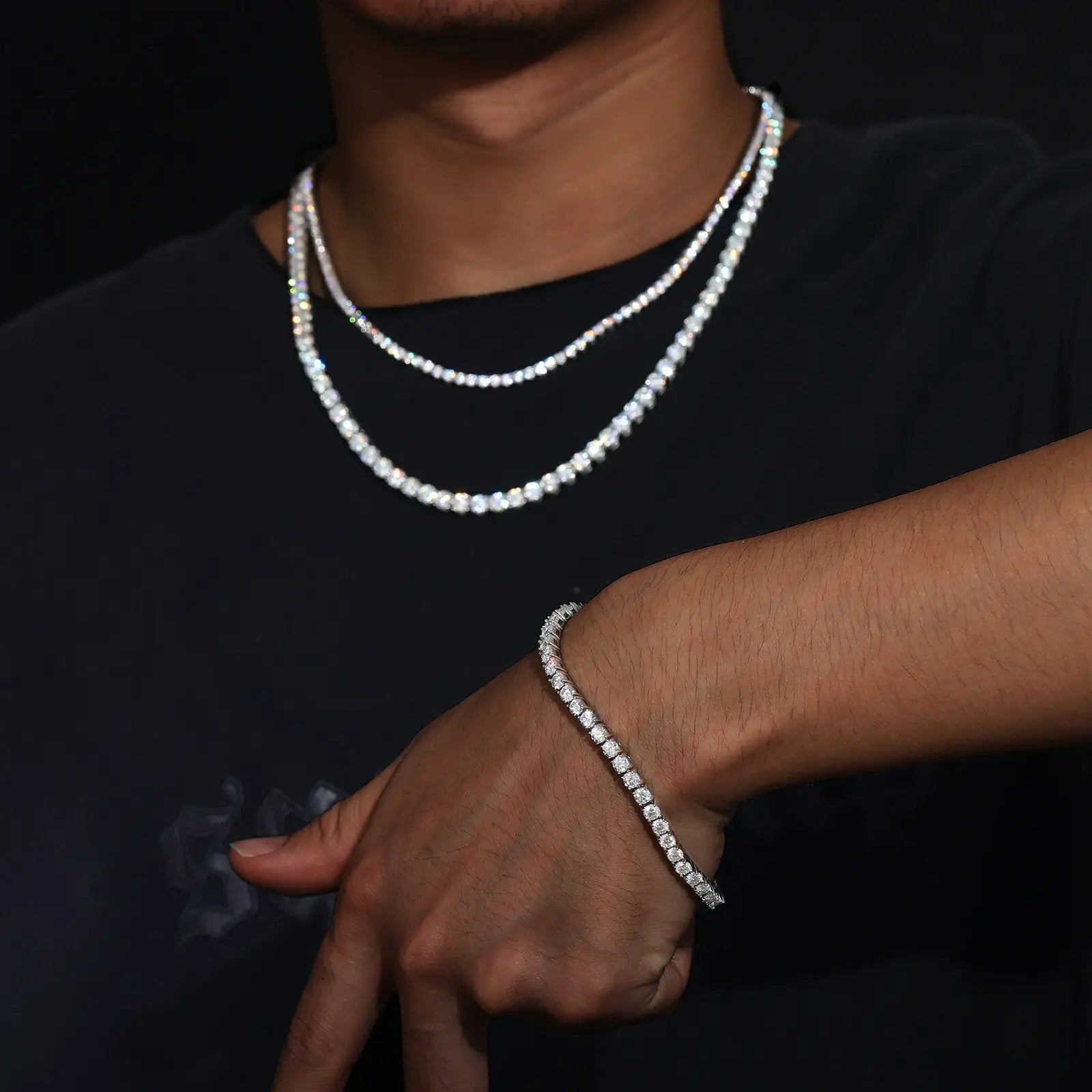 Model wearing white gold 925 sterling silver cluster moissanite tennis chain & bracelet set on black outfit — highlights stacking trend, moissanite durability, 925 silver craftsmanship