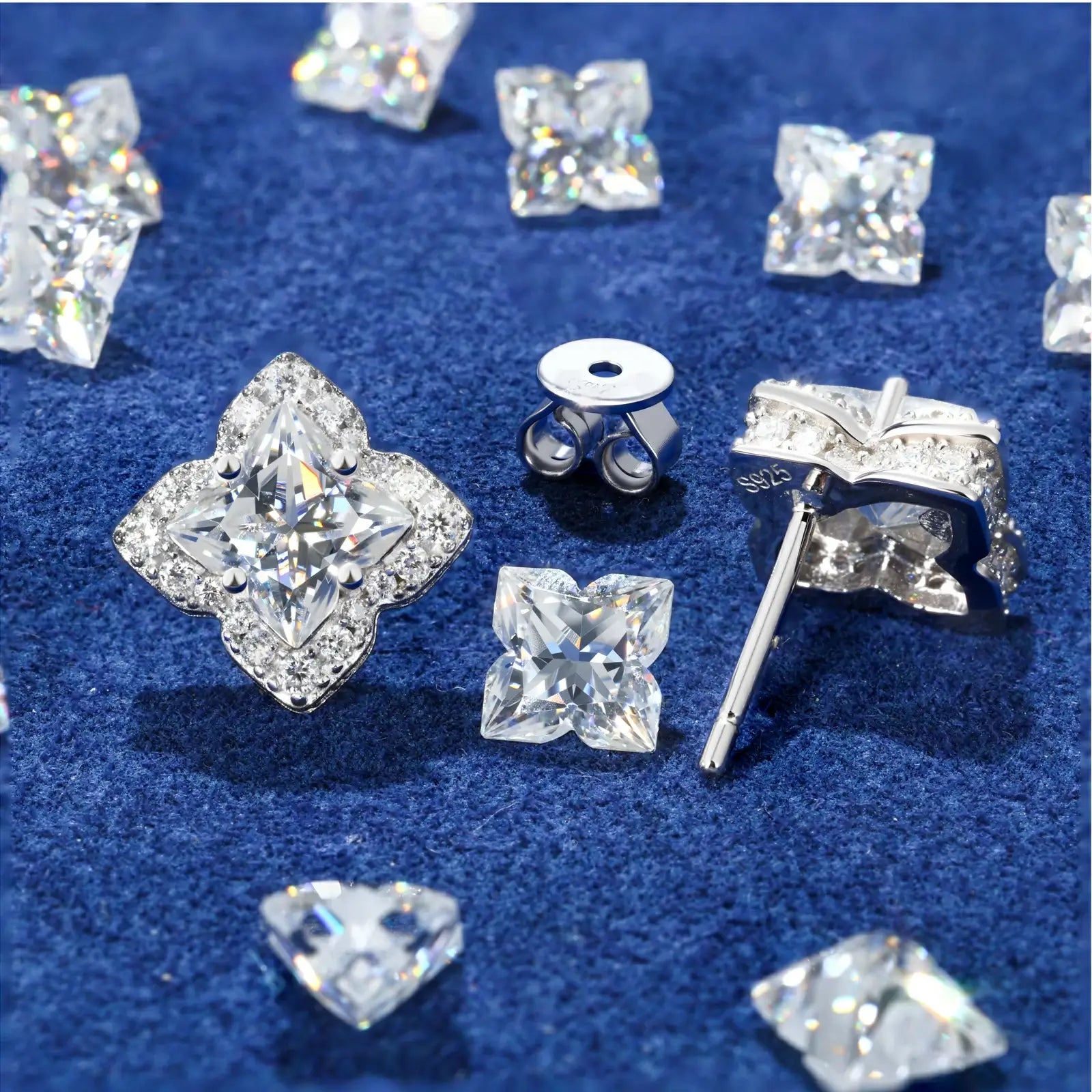 Back close-up of white gold 925 sterling silver lily cut moissanite star stud earring on blue table — showcasing 925 silver post, secure backing, star design craftsmanship