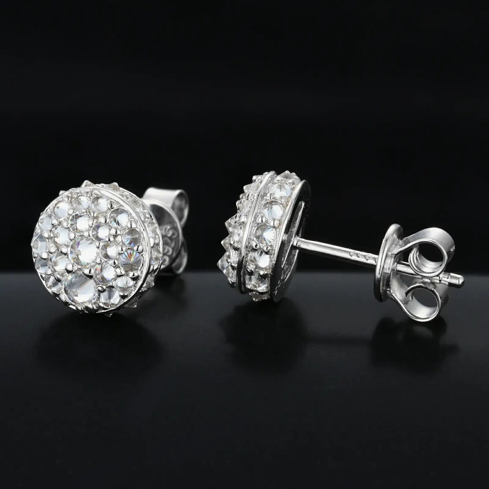 Side close-up of white gold 925 sterling silver moissanite thorns stud earring on black table — highlighting moissanite detailing, thorn texture, 925 silver build