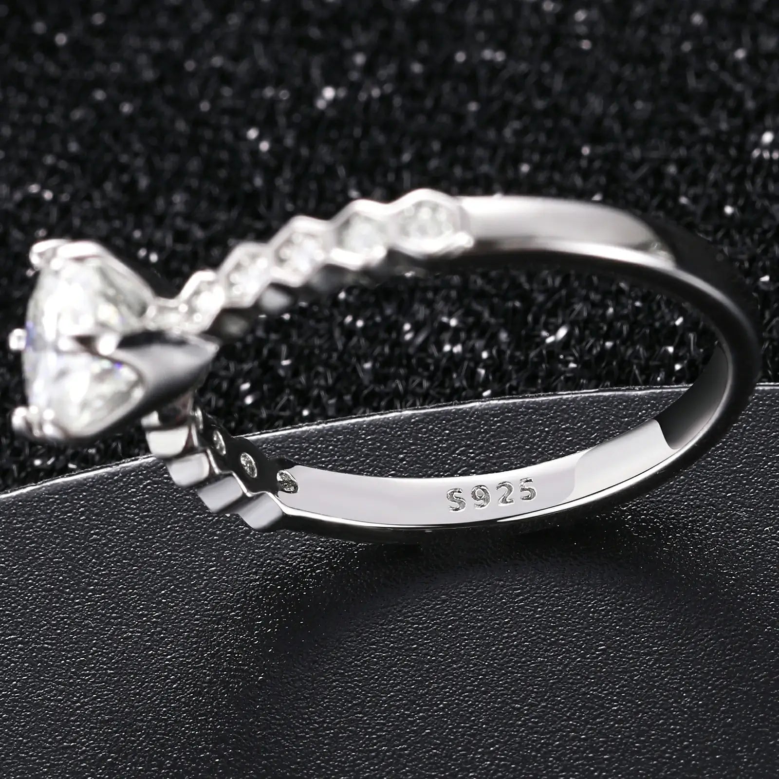 Close-up of white gold S925 moissanite ring S925 stamp — hypoallergenic 925 silver, quality craftsmanship, eternal nine stars design
