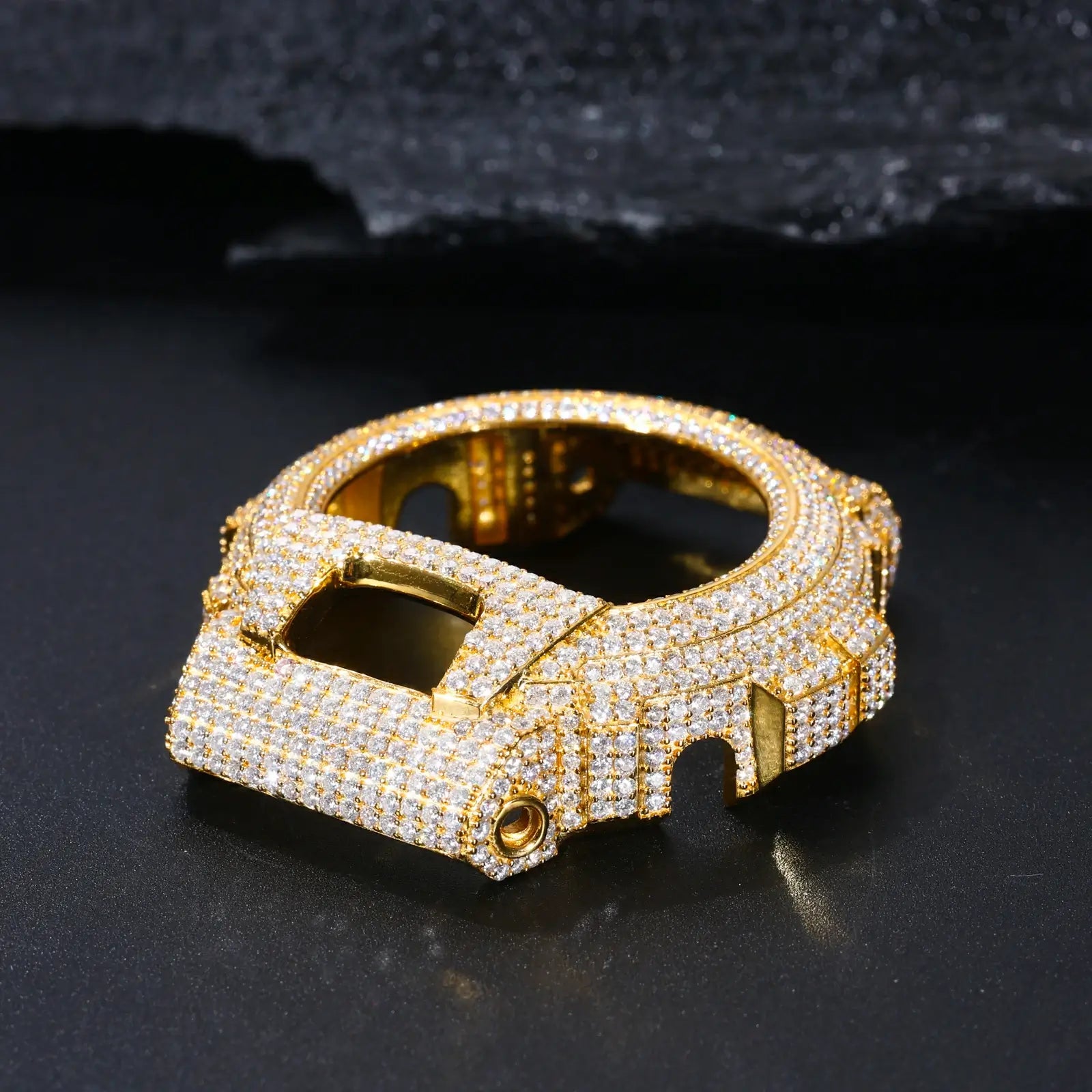 Close-up of yellow gold 925 sterling silver moissanite G-Shock DW6900 watch case on black background — showcases moissanite detailing, 925 silver build, iced-luxury trend