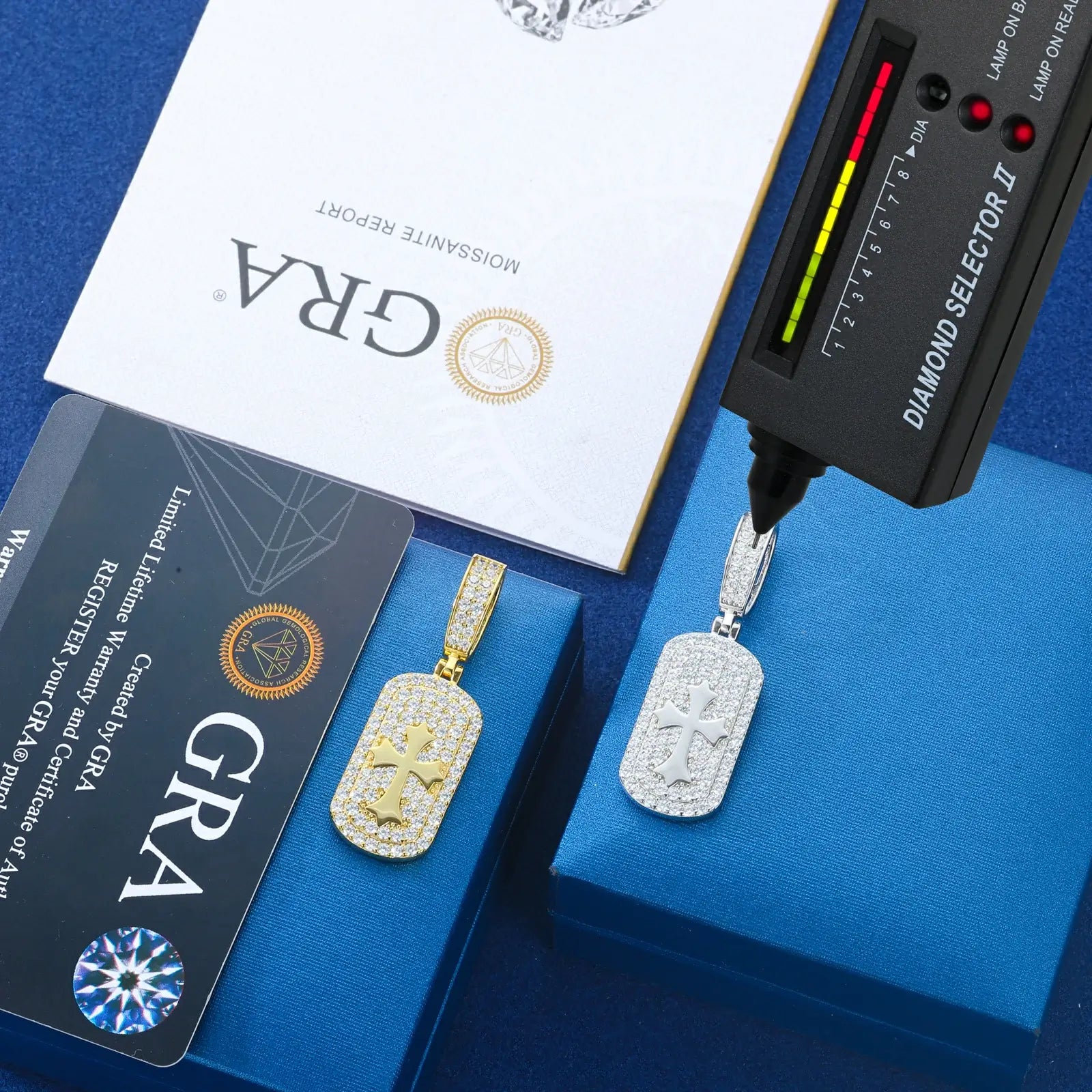 Yellow gold & white gold 925 sterling silver moissanite cross sign dog tag pendants with diamond tester + GRA certificate on blue table — certified moissanite jewelry