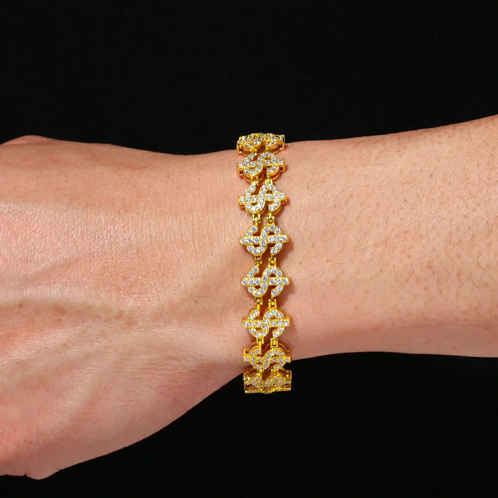 Black male model styling yellow gold plated S925 dollar chain bracelet - 120+ VVS moissanites flashing in sunlight with hip-hop luxe edge