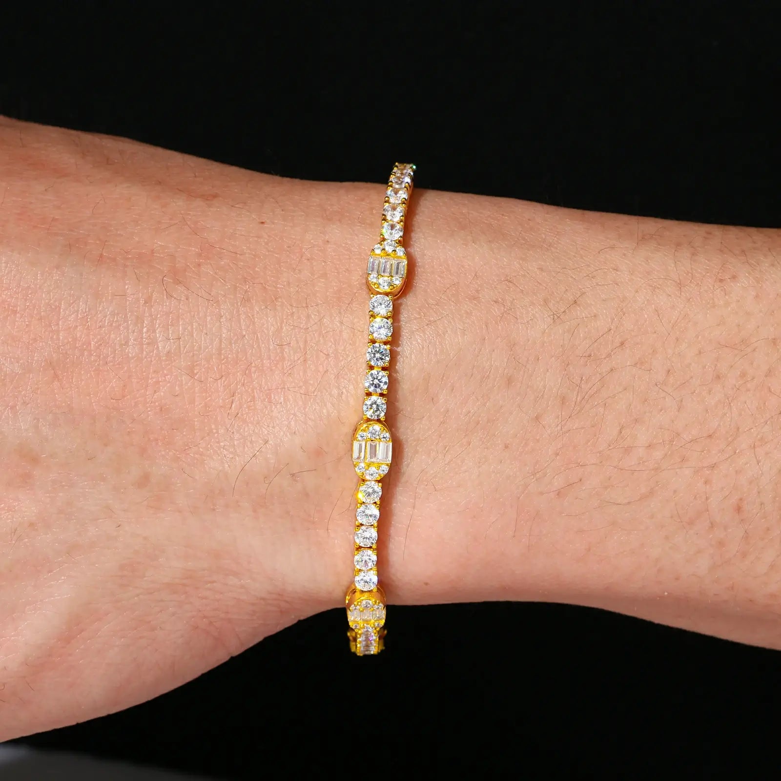 Black male model styling yellow gold pills bracelet - 5.5mm capsule links with VVS moissanites for hip-hop luxury look