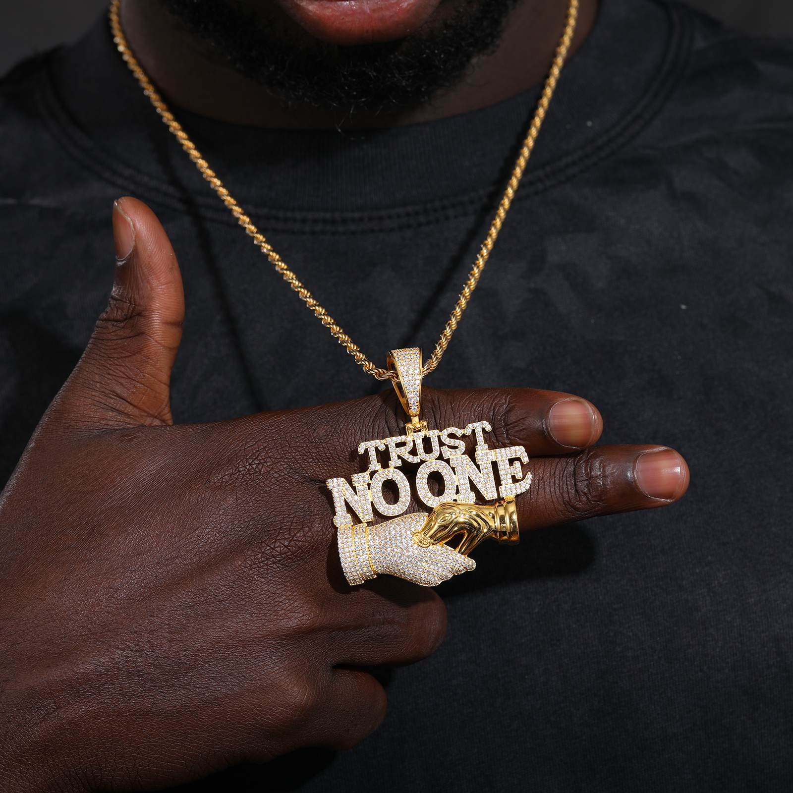 African American man styling "TRUST NO ONE" trap pendant - S925 silver core with hypoallergenic 18K gold plating | Street-luxe statement piece