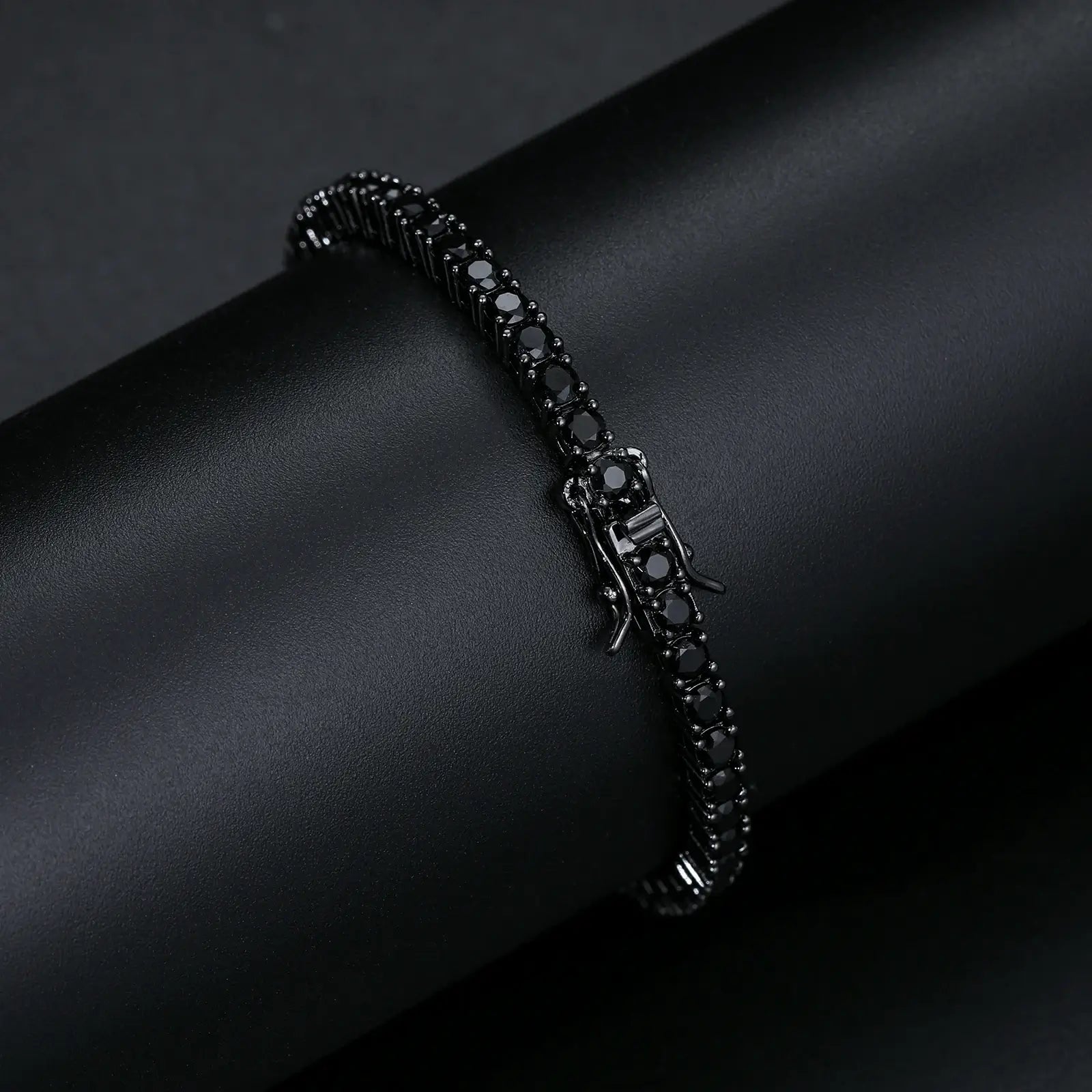 Close-up of black and gold clasp on 3mm moissanite tennis bracelet, featuring secure lobster mechanism and premium craftsmanship