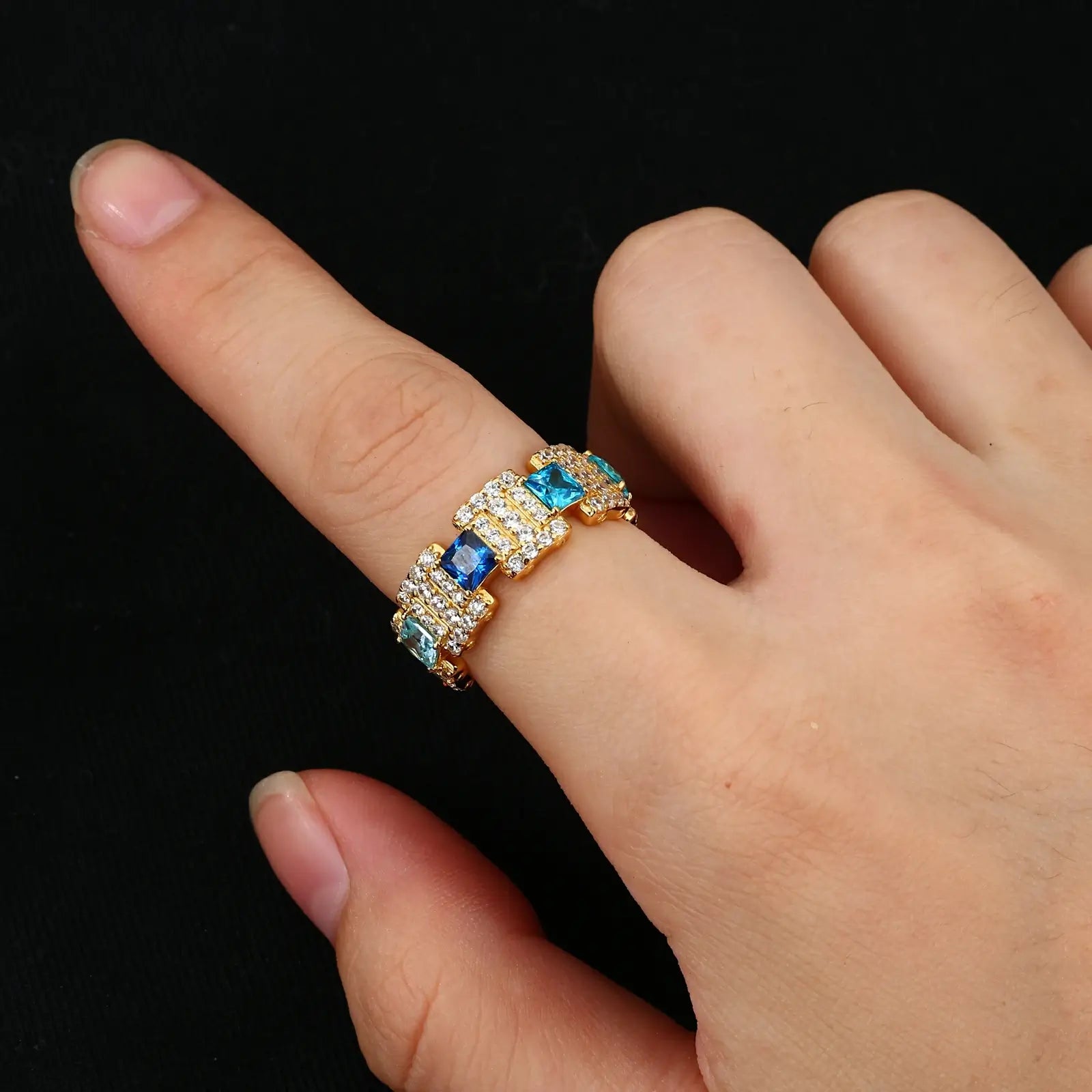 African American man styling gold ocean wave ring - gradient blue moissanites on S925 silver | Hypoallergenic men's luxury ring