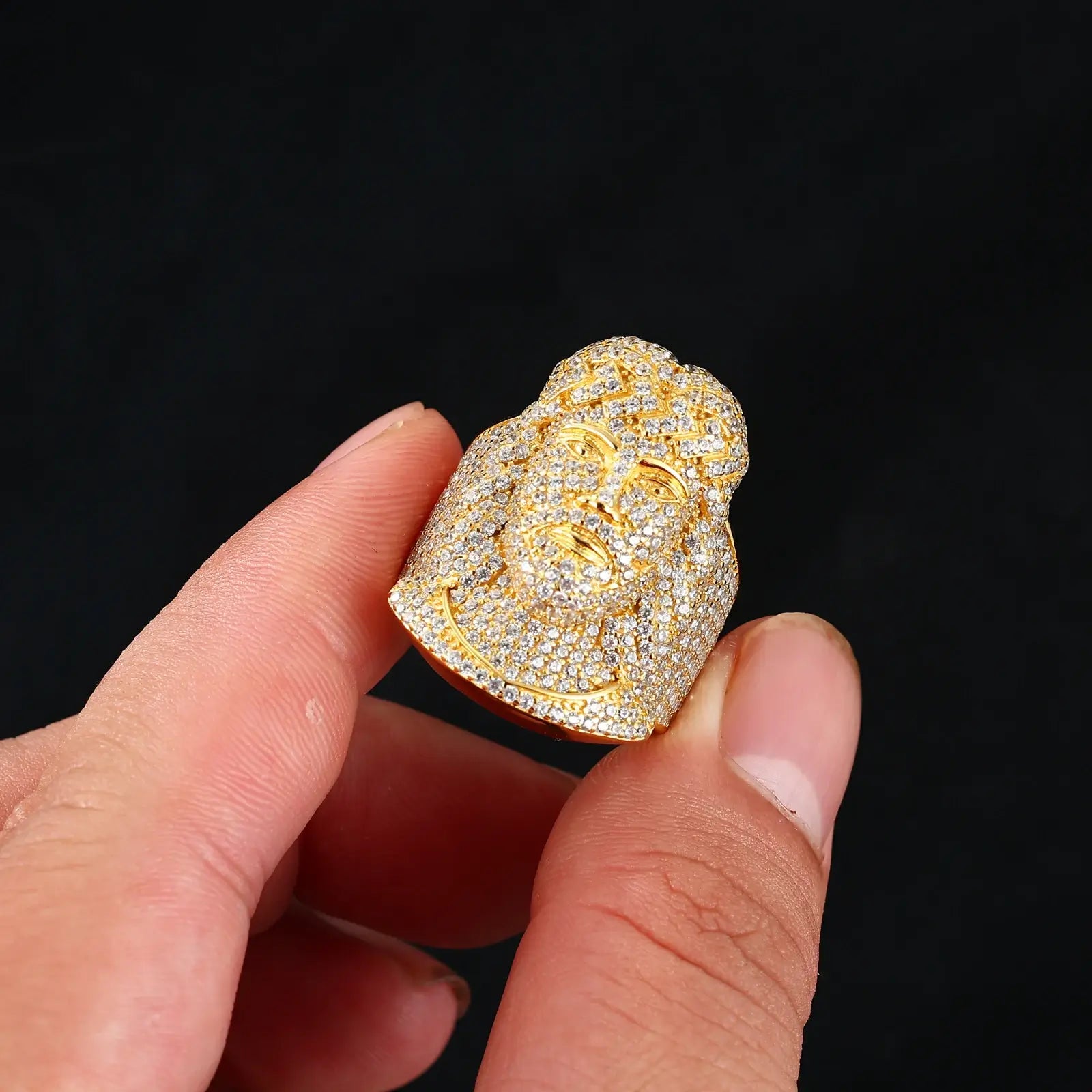 African American man holding gold Jesus portrait ring - dimensional relief with 78 moissanites | Hypoallergenic faith statement