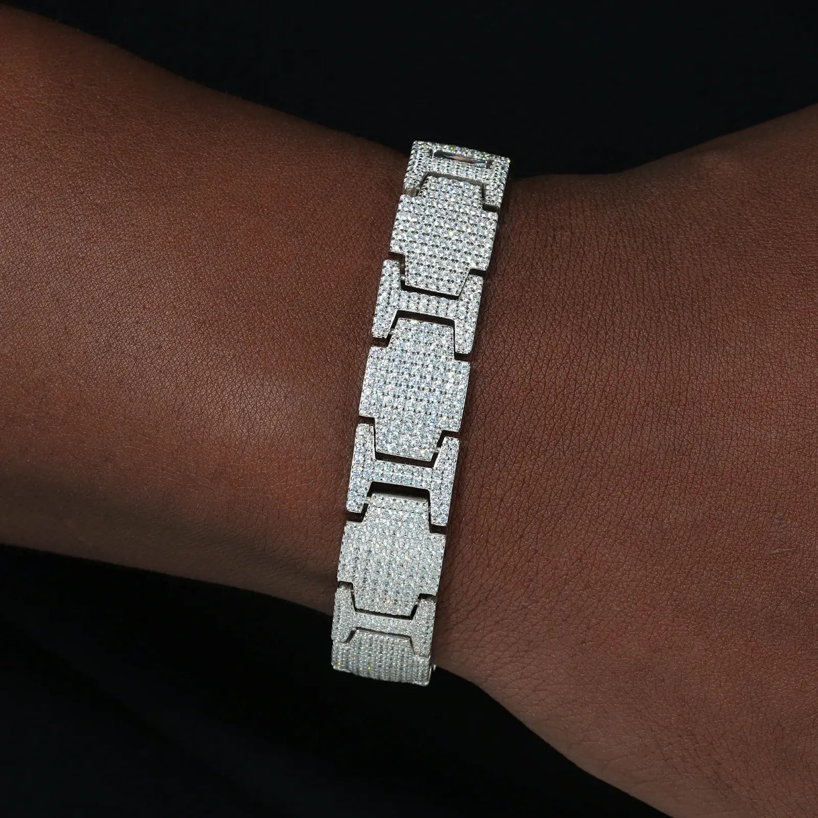 African American man wearing 14mm white gold plated S925 bracelet - moissanite stones contrasting dark skin in luxury mechanical style
