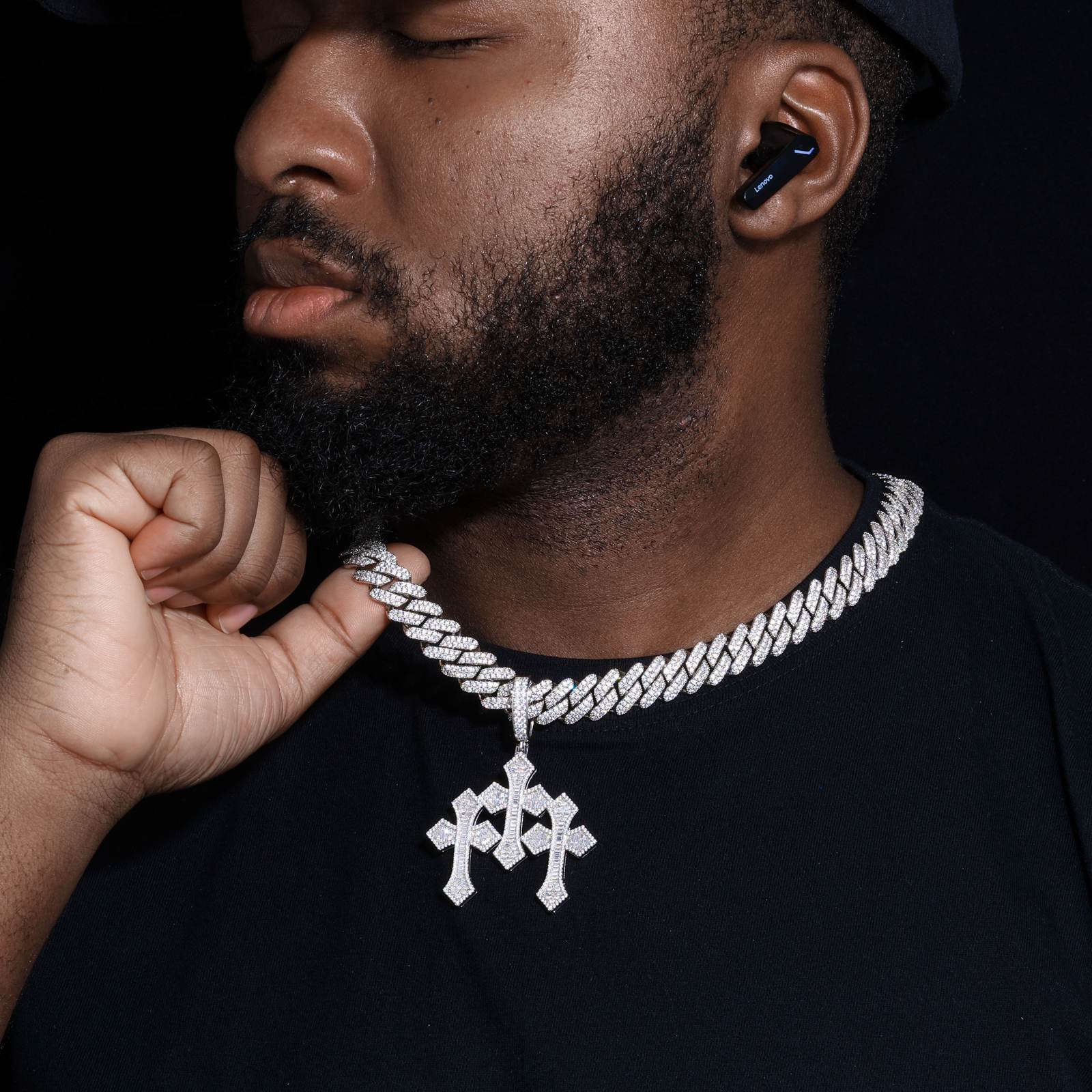 African American male model wearing S925 triple cross pendant with 37 baguette moissanites, layered with thick 24K gold Cuban chains in urban street style