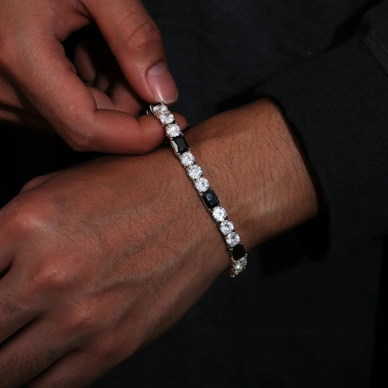 Extreme close-up: 6mm black/white bracelet clasp showing S925 stamp - contrast stones against melanin skin | Tarnish-proof plating guarantee
