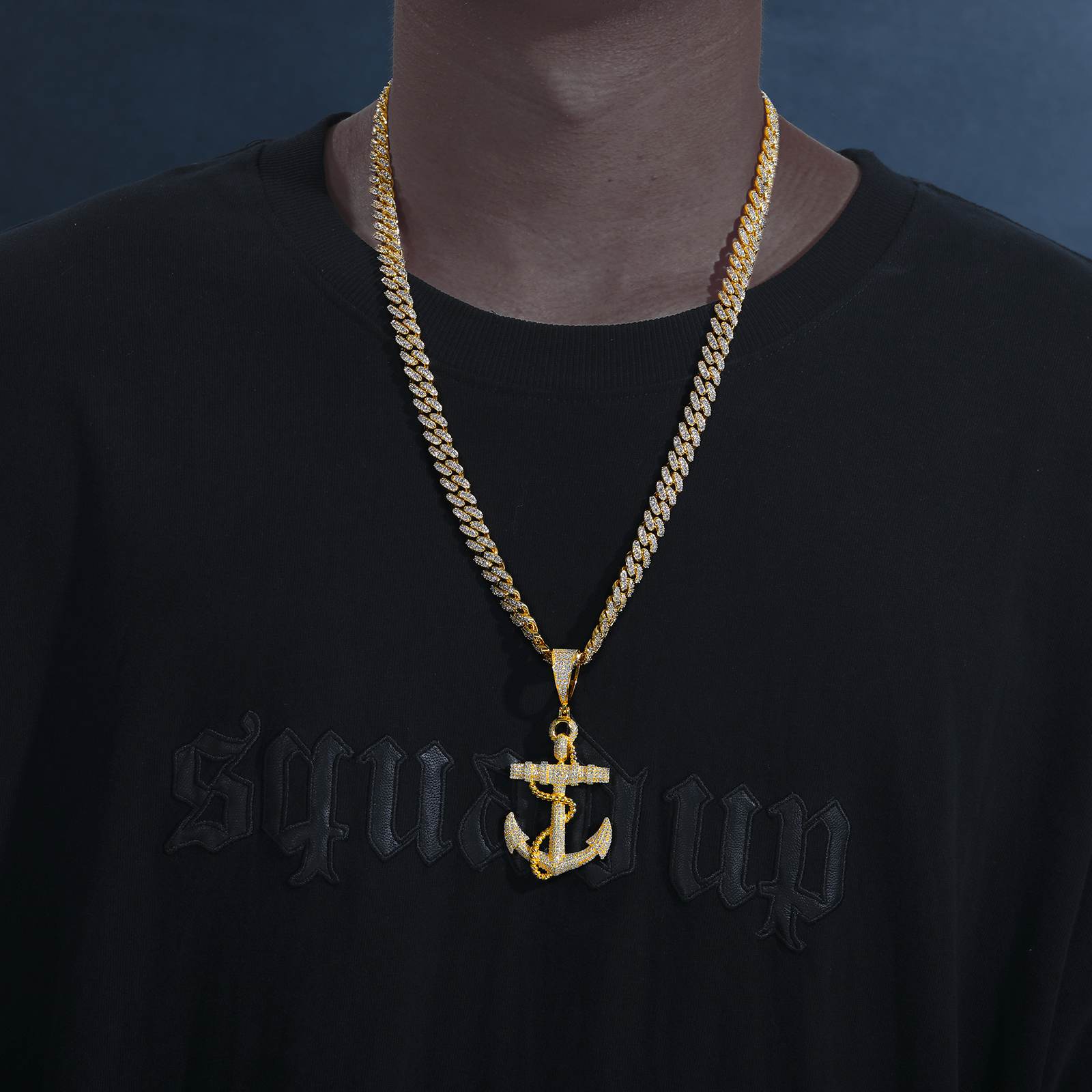 African American captain styling gold anchor pendant on Cuban chain - 42 VVS moissanites refracting > diamonds | Salt-spray certified armor